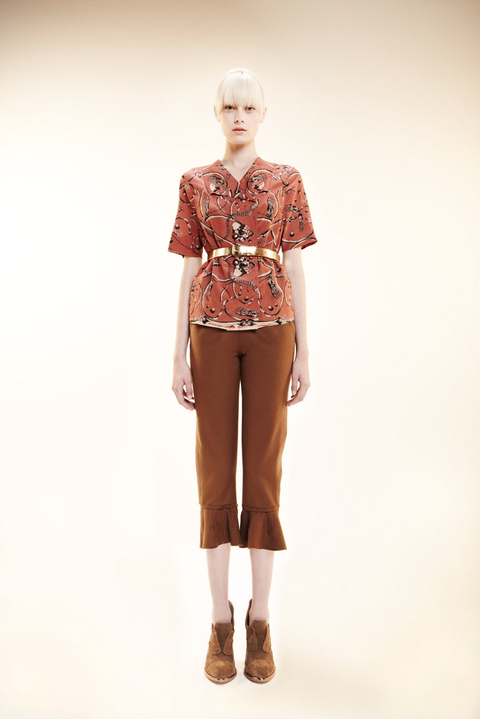 orange short-sleeve collared fitted printed top