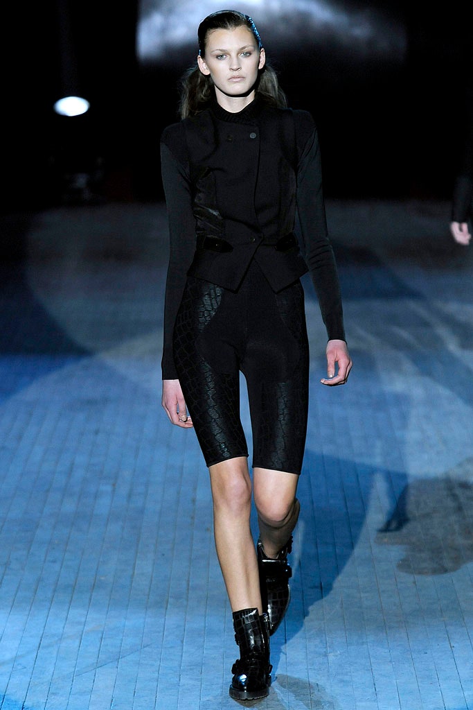 black leather fitted vest and bodysuit