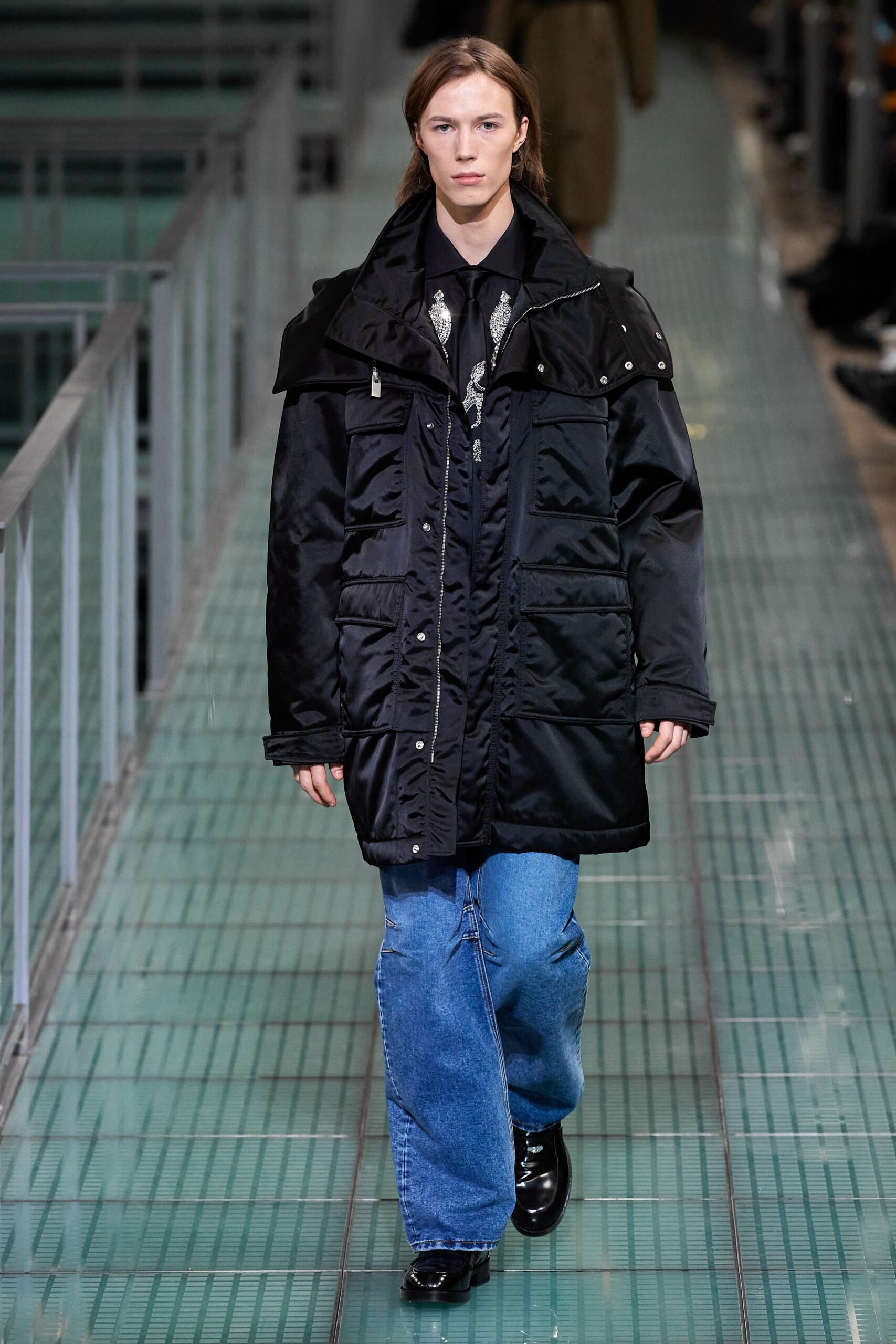 black relaxed jacket with blue denim pants