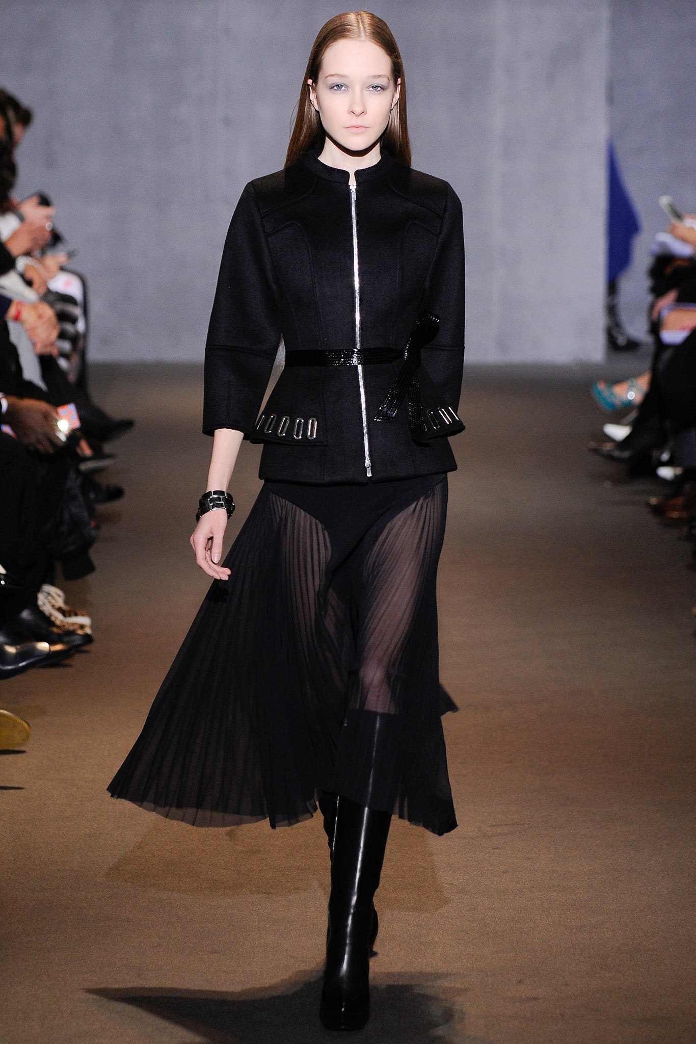 black fitted jacket and pleated skirt