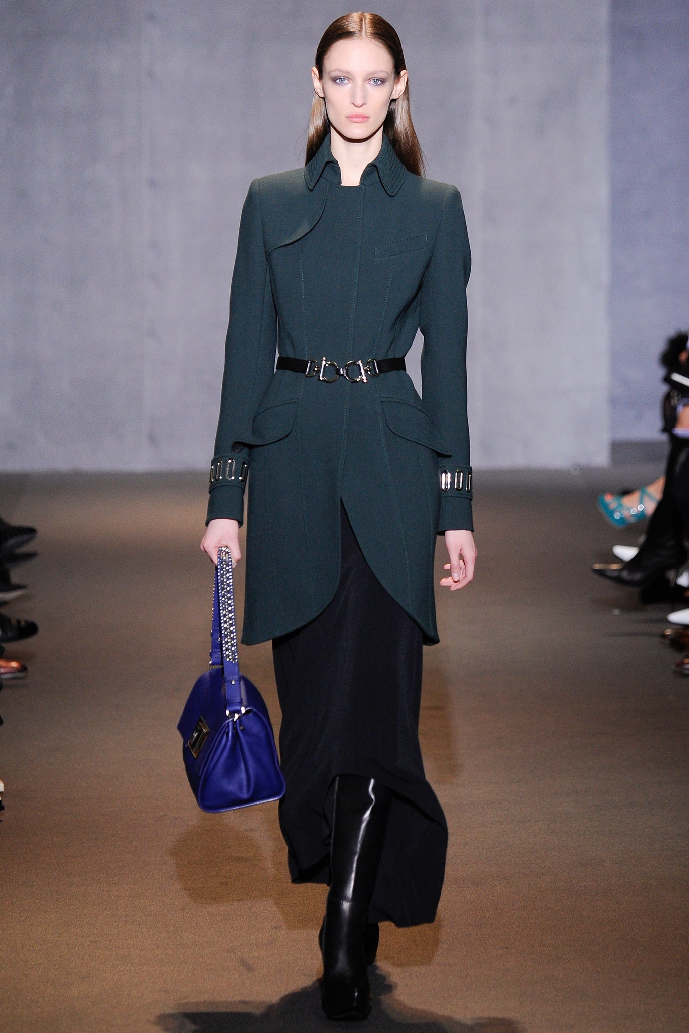 green fitted coat with black skirt