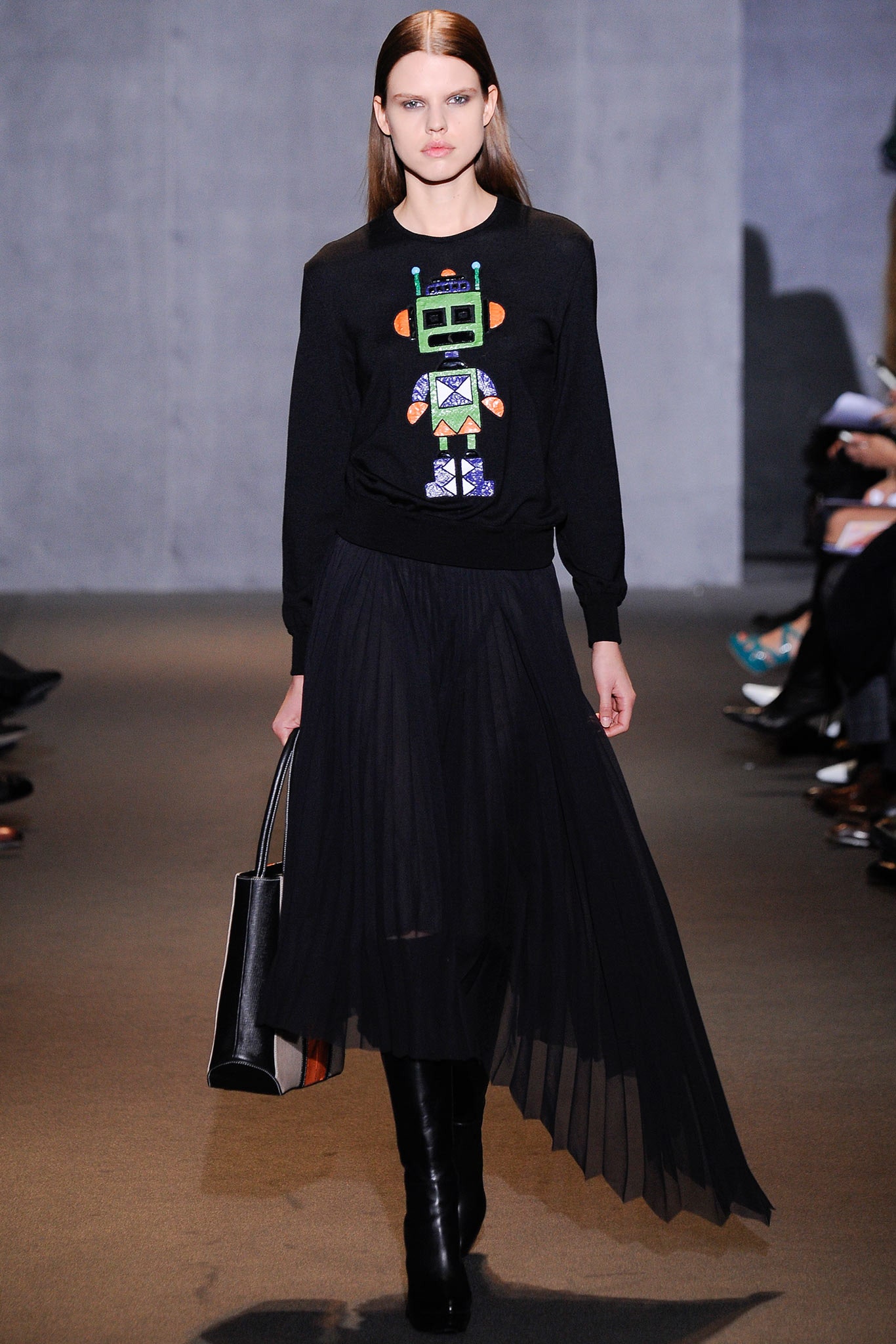 black embroidered sweater with pleated skirt