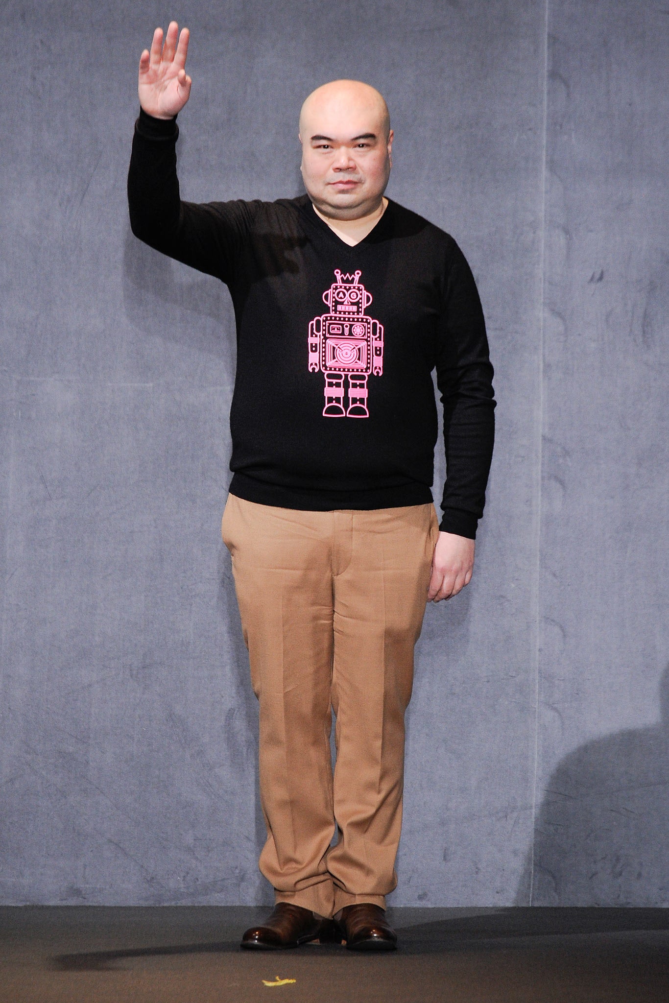 black sweater beige pants