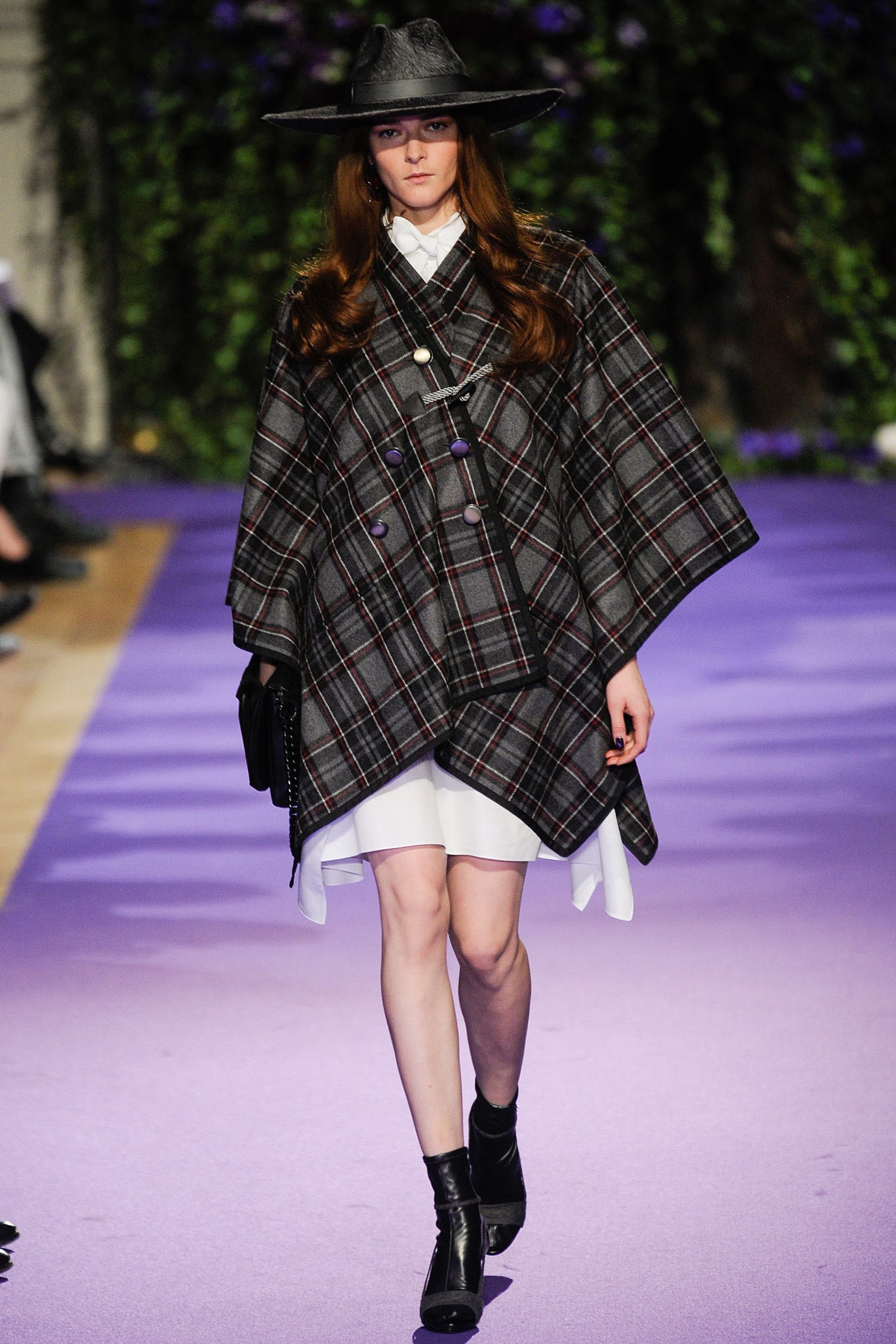 checked poncho over white dress