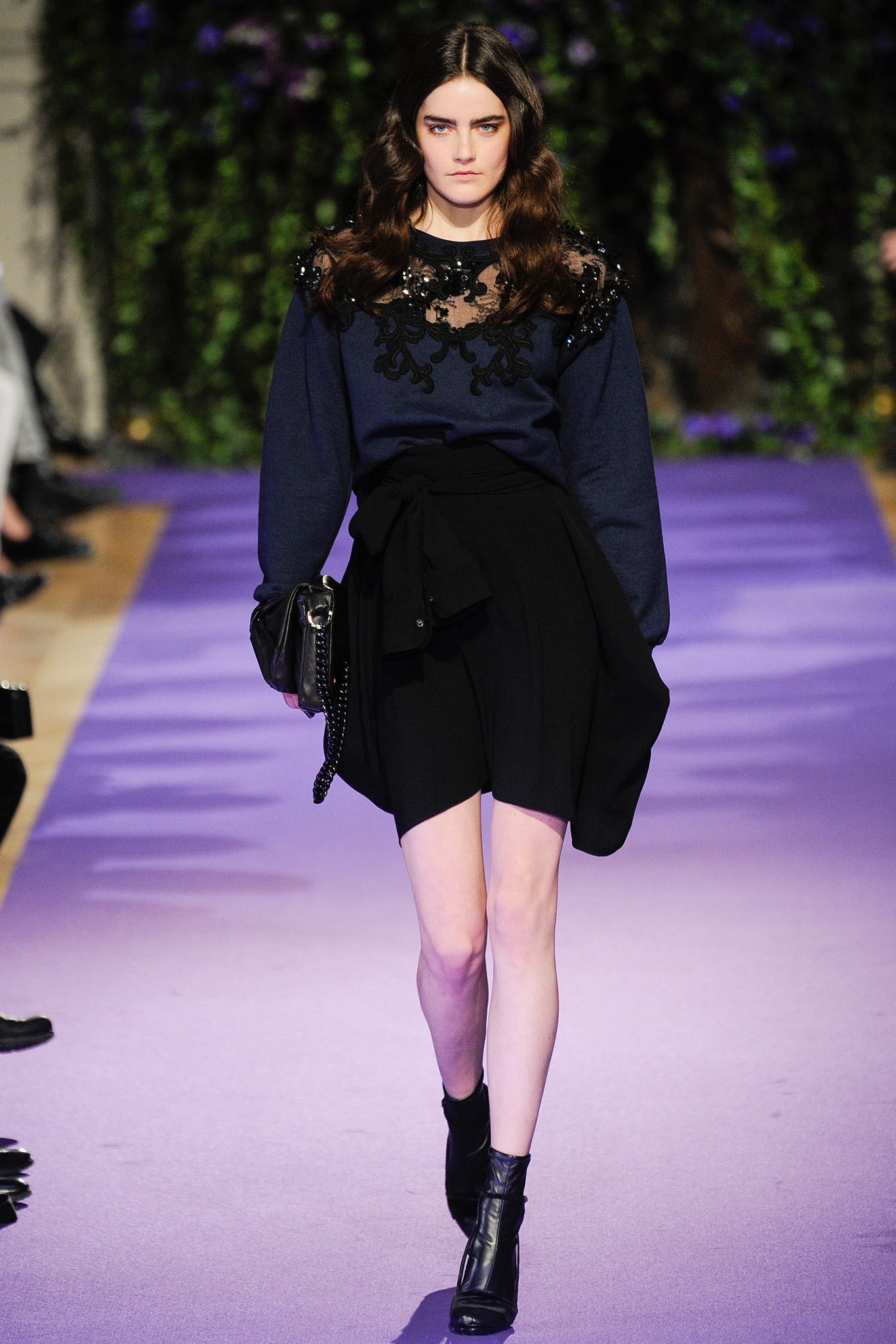 blue embroidered sweater and black skirt