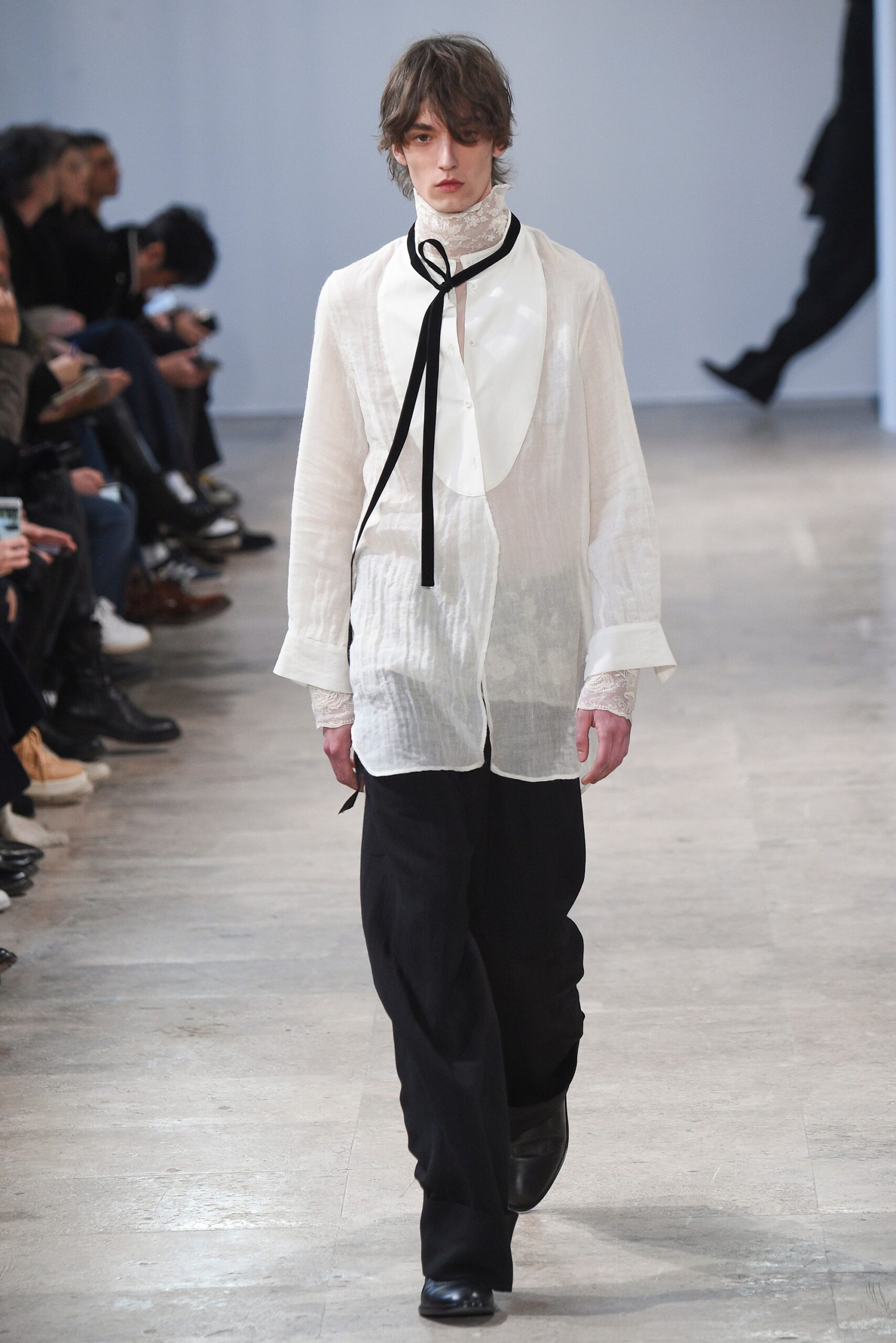 white relaxed shirt and black pants
