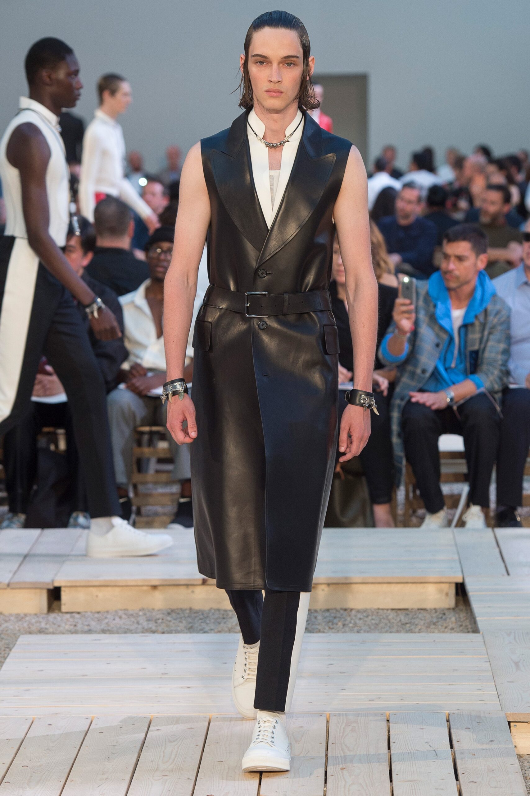 black leather sleeveless collared fitted belted coat