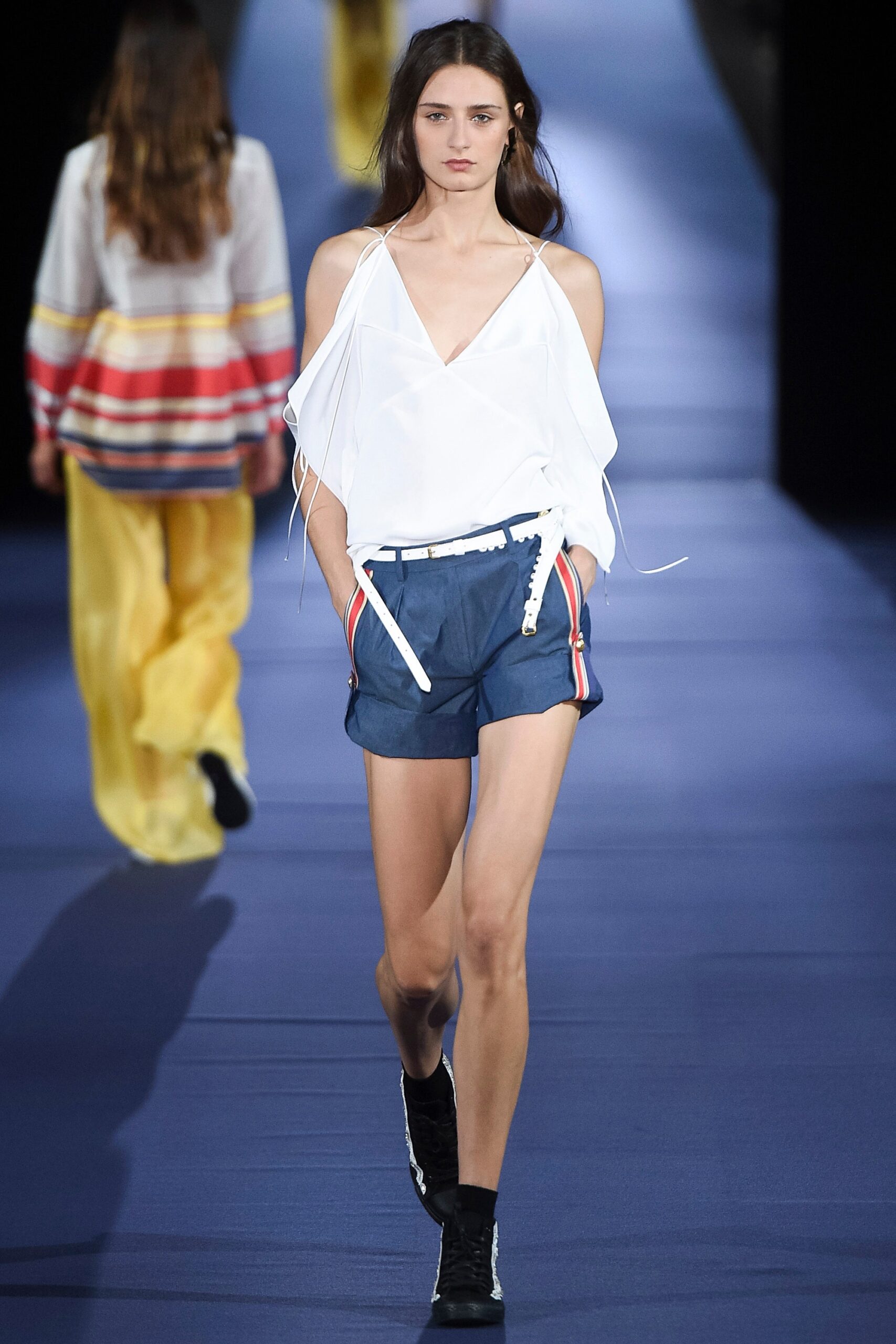 white relaxed top with blue shorts