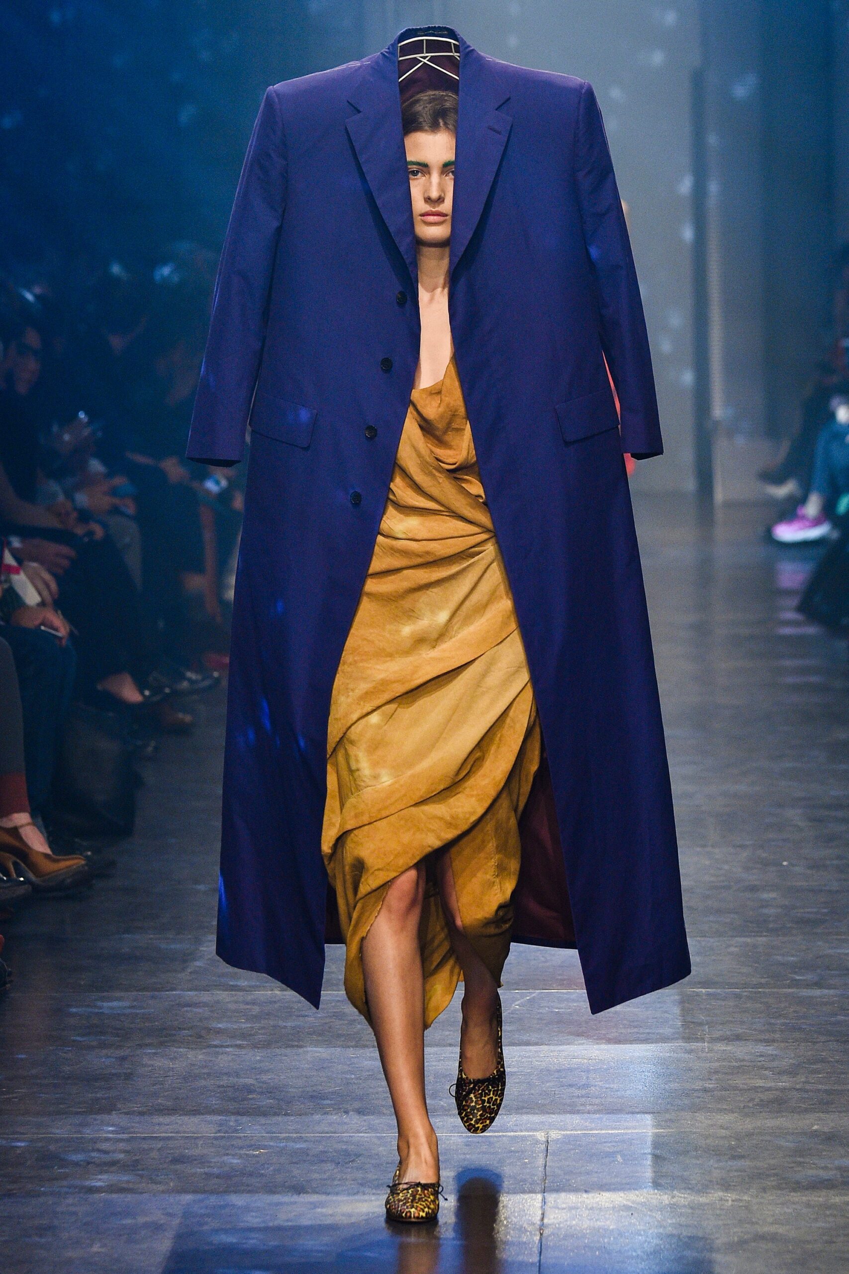 gold silk gown with oversized blue coat