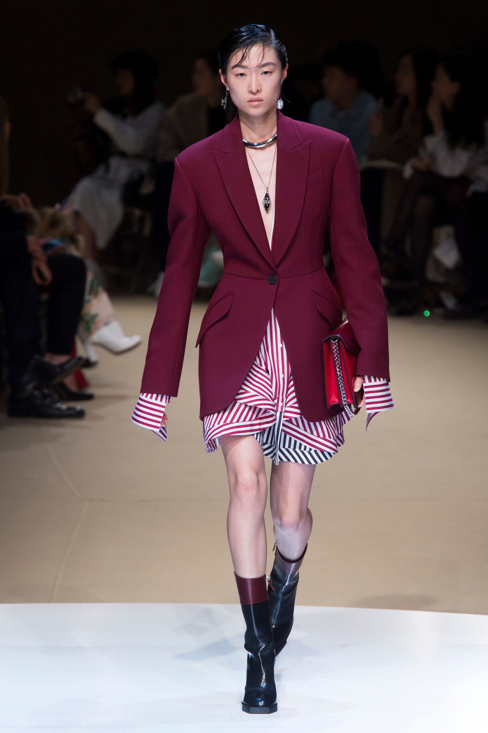 red tailored blazer with pleated skirt