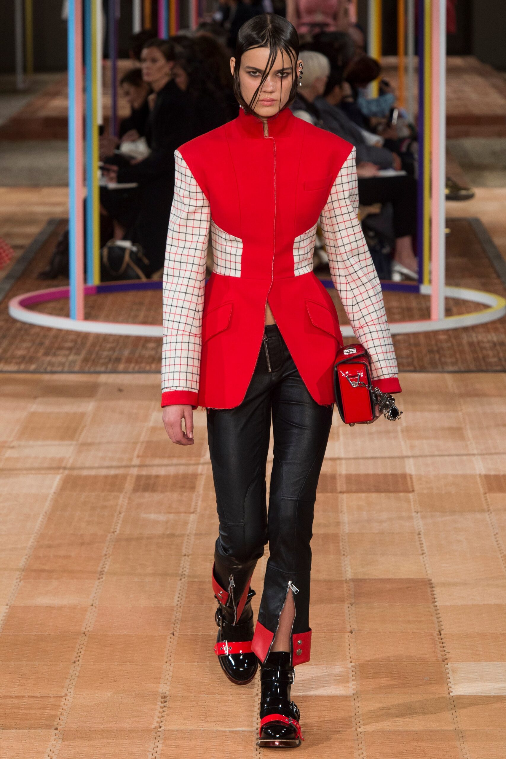 red and white fitted jacket with leather pants