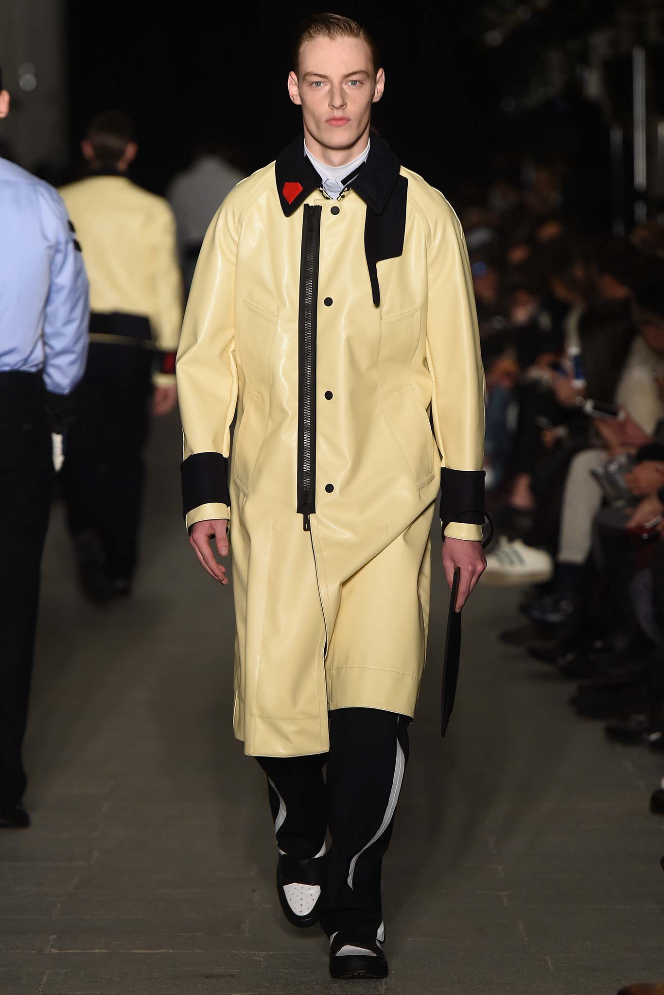 yellow vinyl coat with black pants