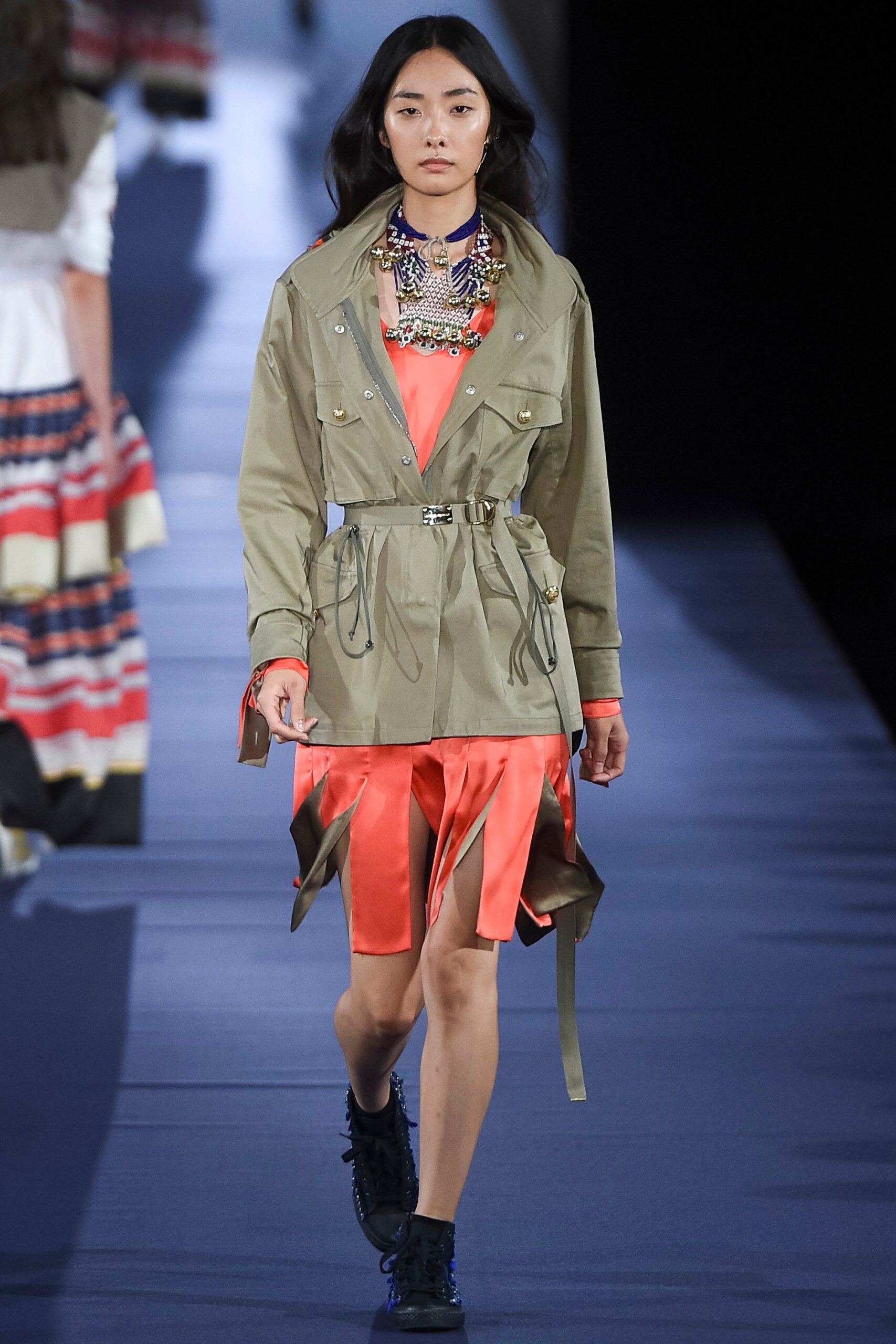 green jacket with orange dress