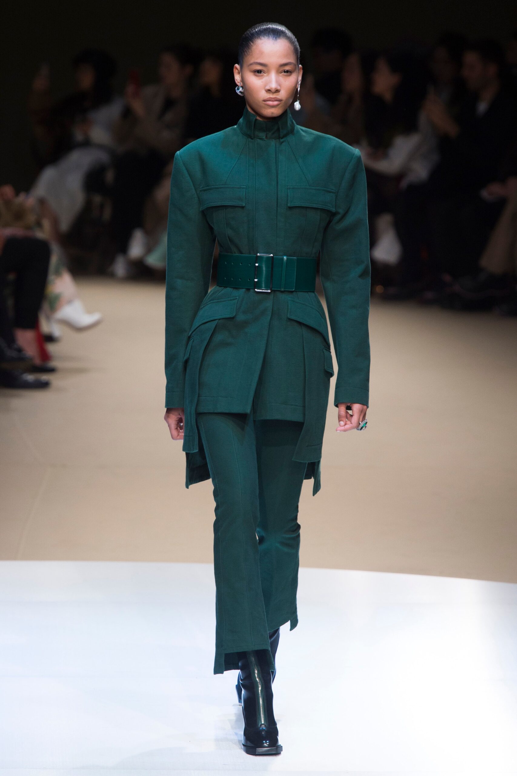green fitted suit with belt