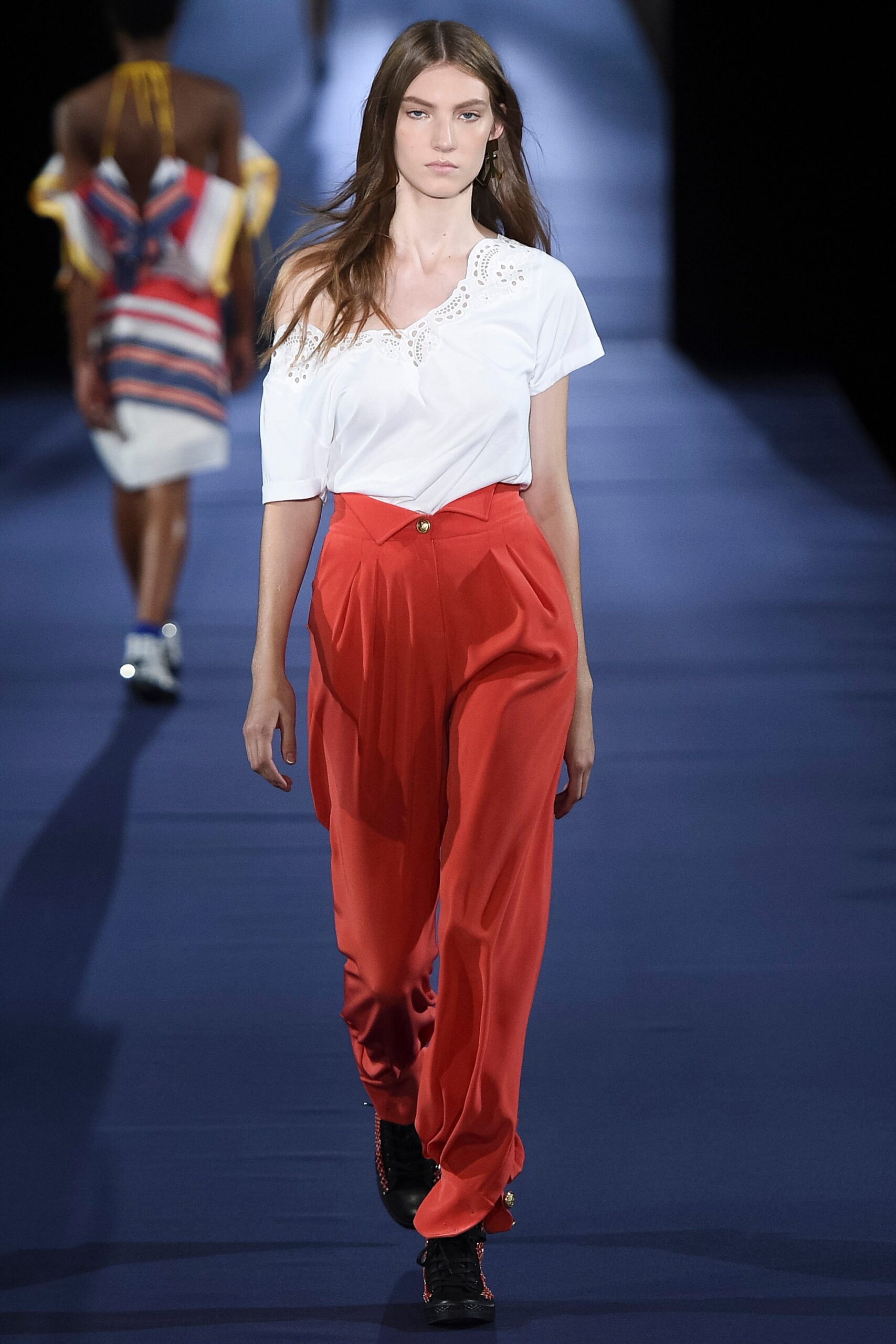 white embroidered top and red pants