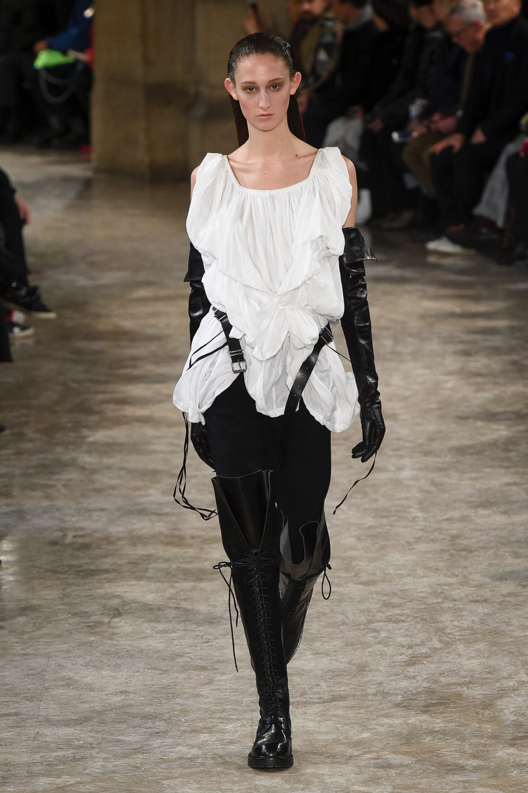 white ruffled top with black leather pants