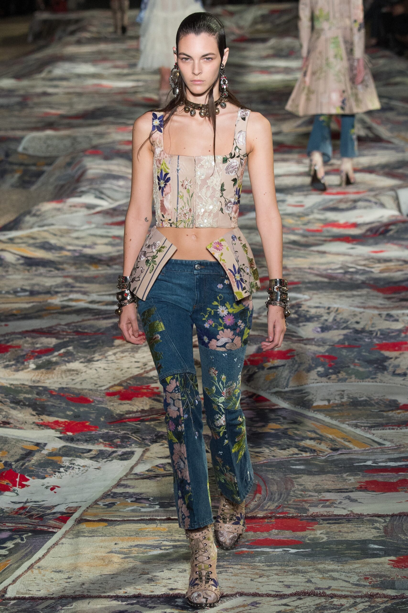 embroidered beige top with flared jeans