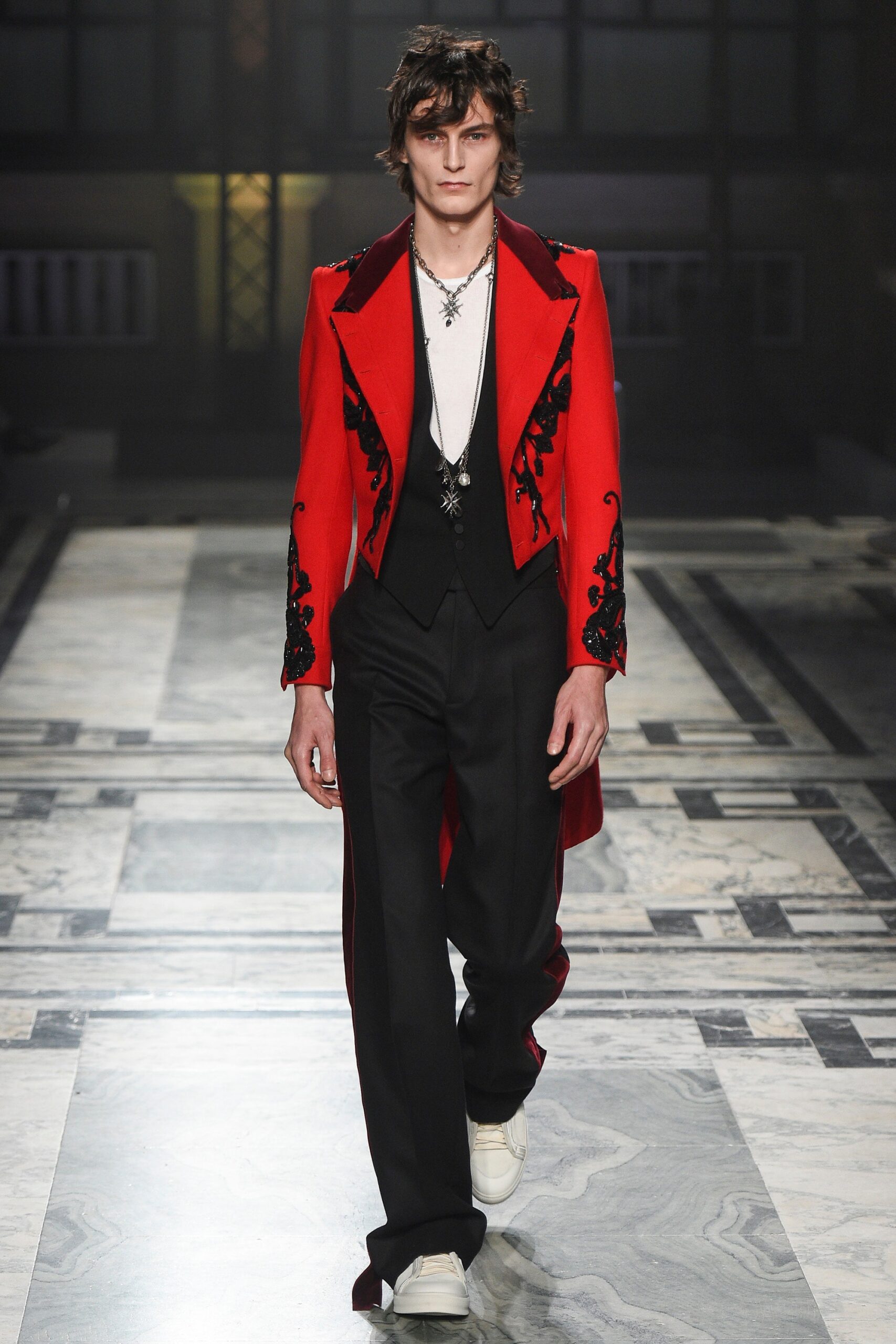 red embroidered coat with black vest