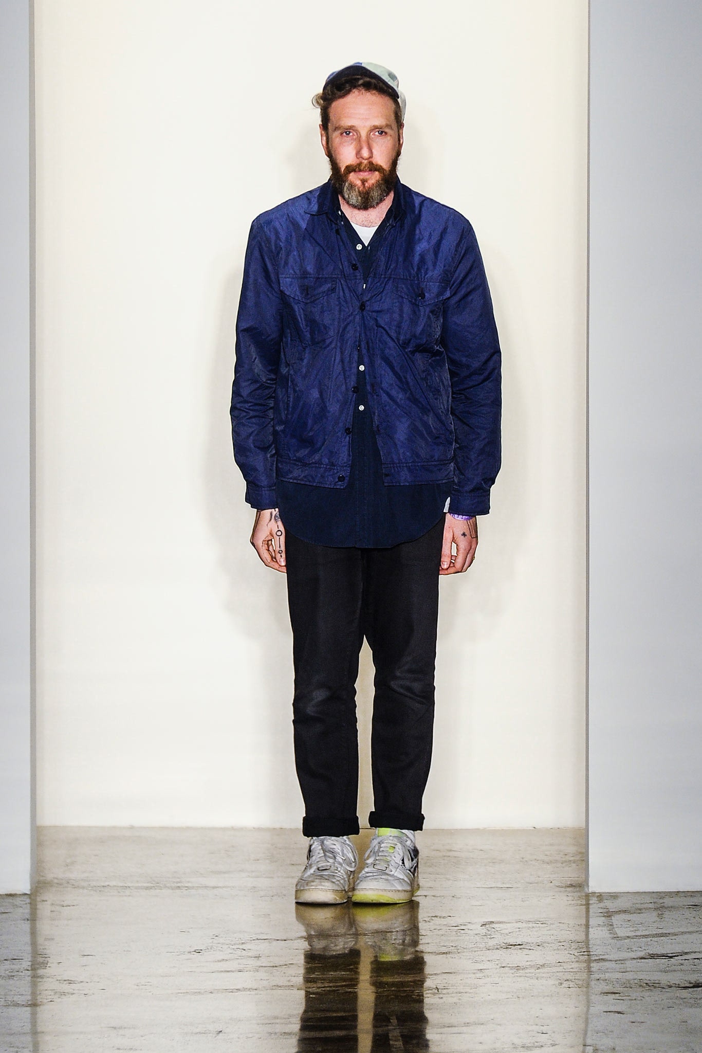 blue jacket black shirt and pants