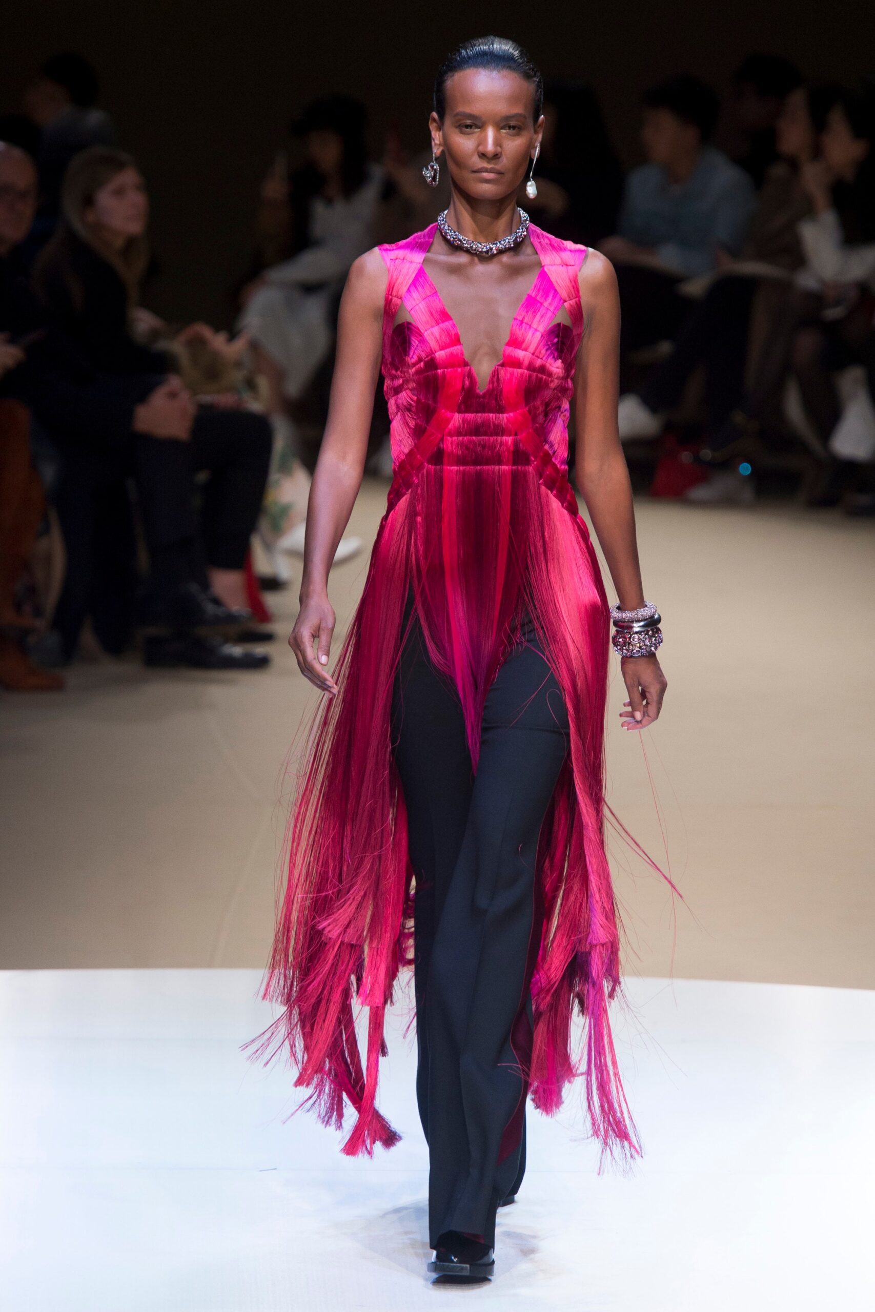 pink fringed midi dress with black pants