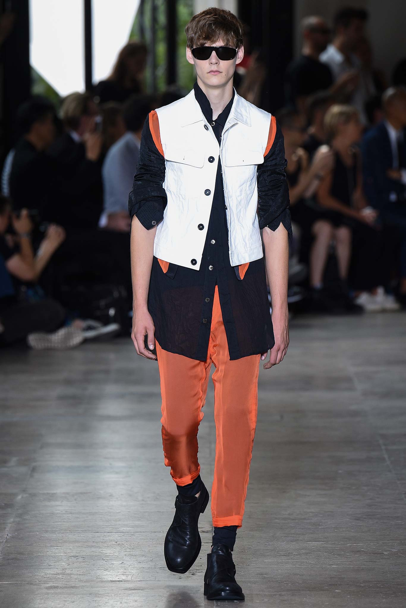 black and white color-blocked shirt with orange pants