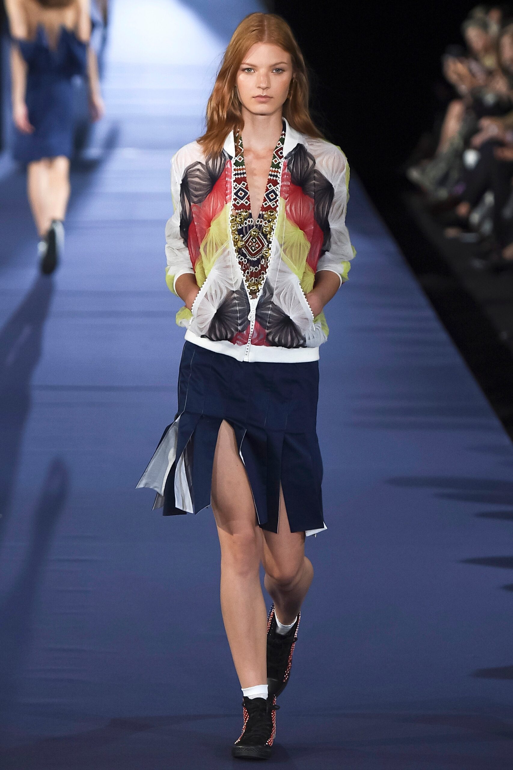 multi-colored fitted jacket with navy skirt