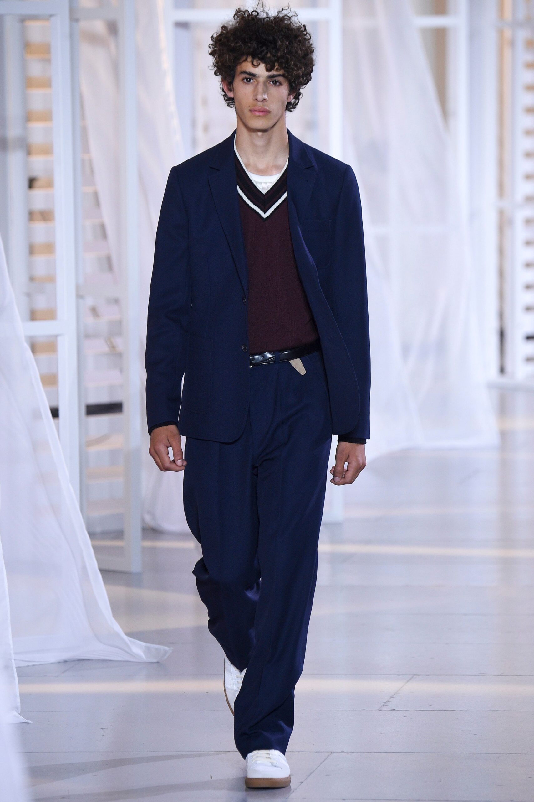 navy tailored suit with maroon sweater