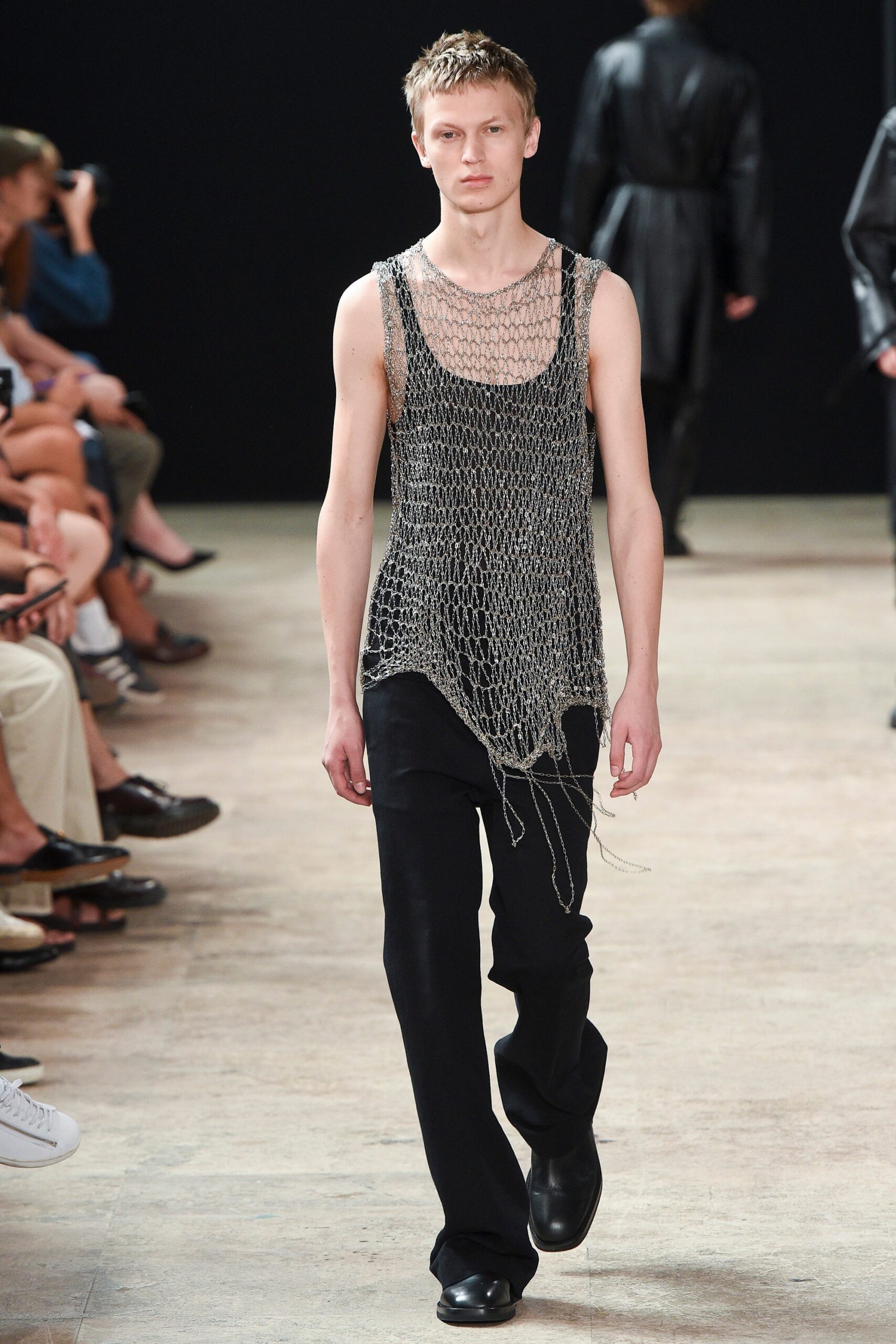 gray sheer tank-top and black pants