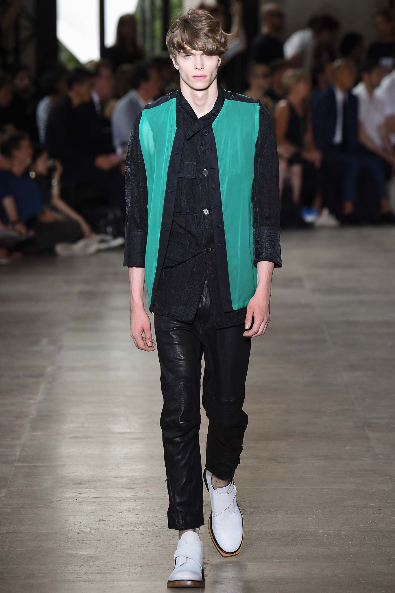 green vest black shirt and pants