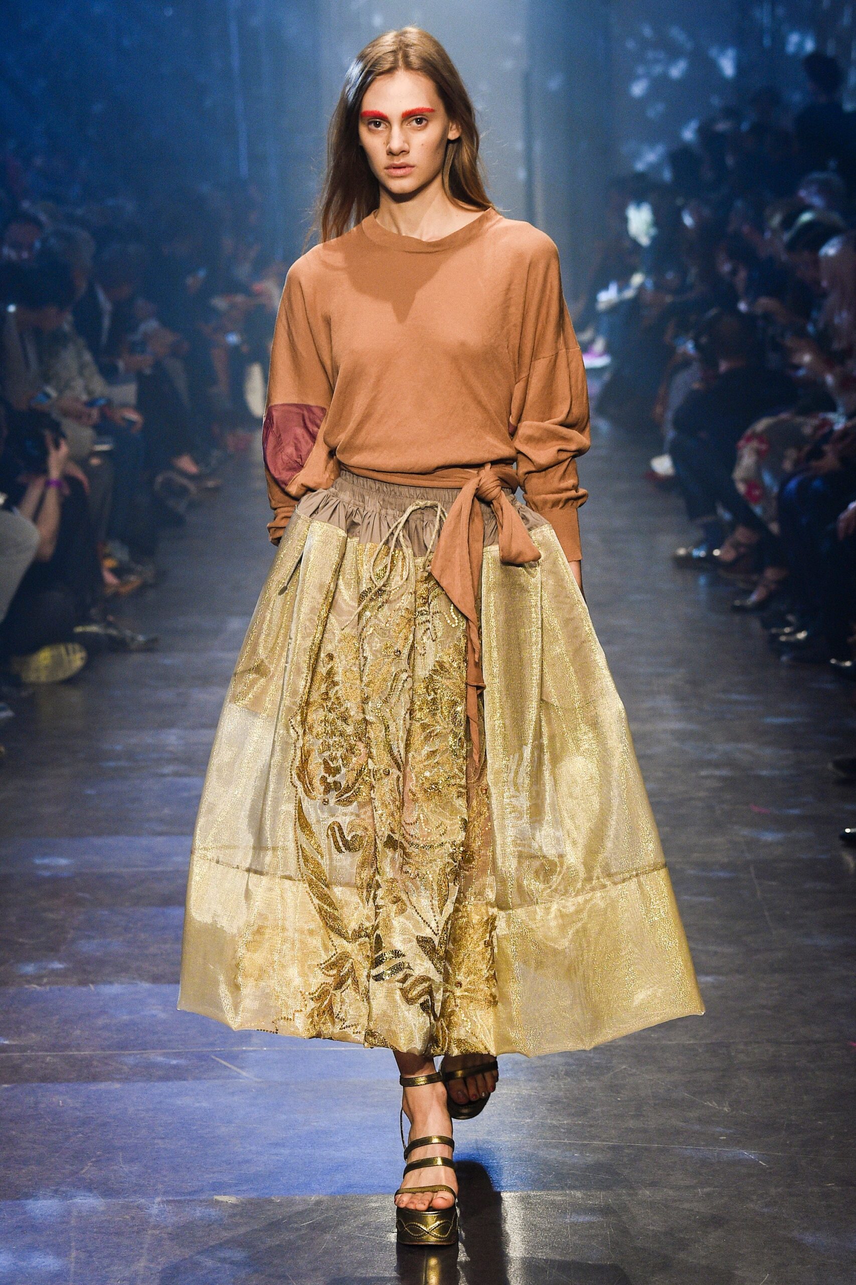 brown relaxed top with gold skirt