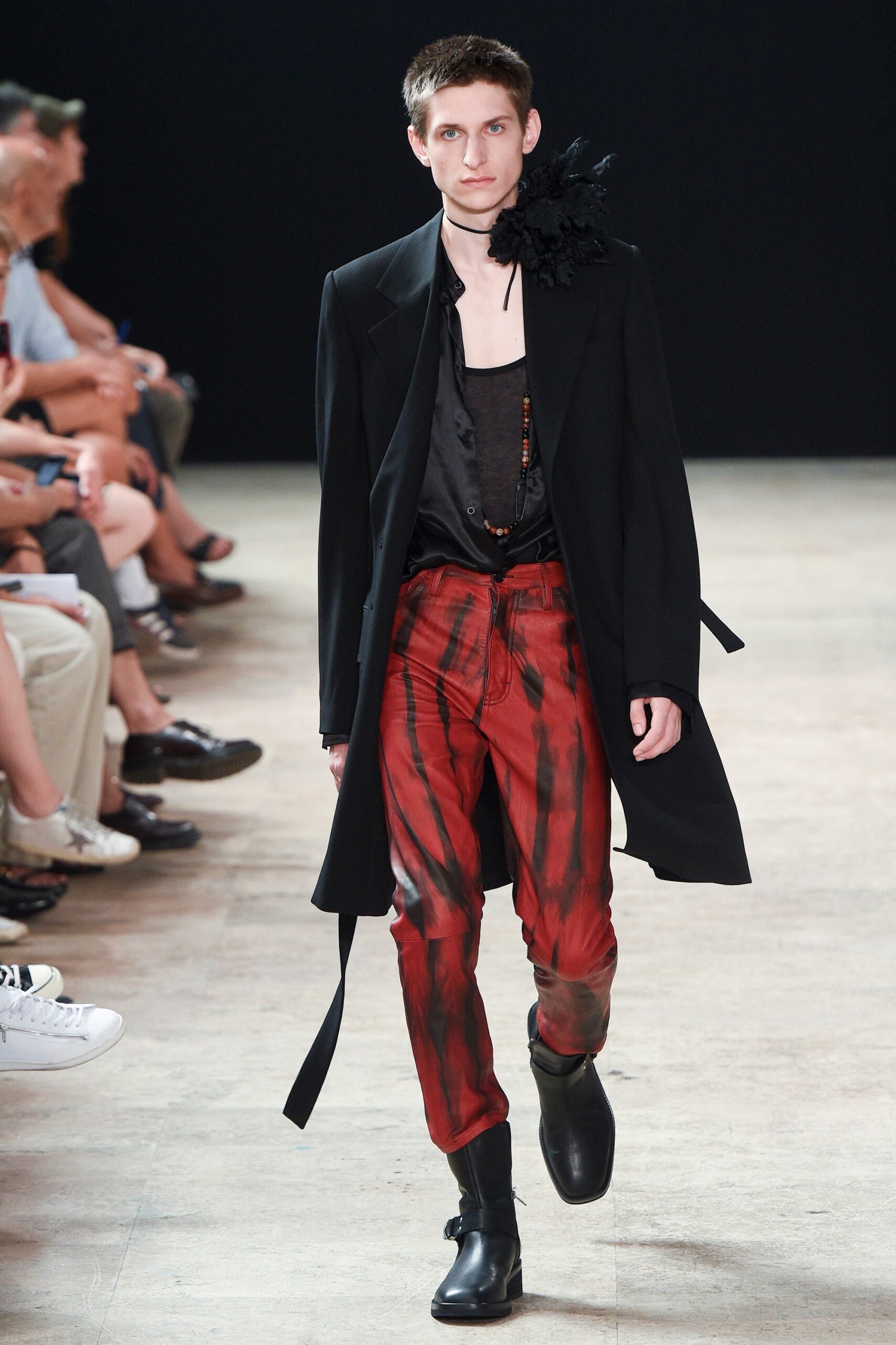 black coat with red pants