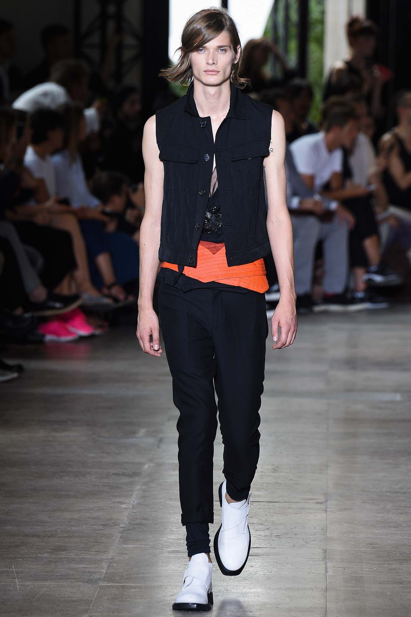 black vest orange top black pants