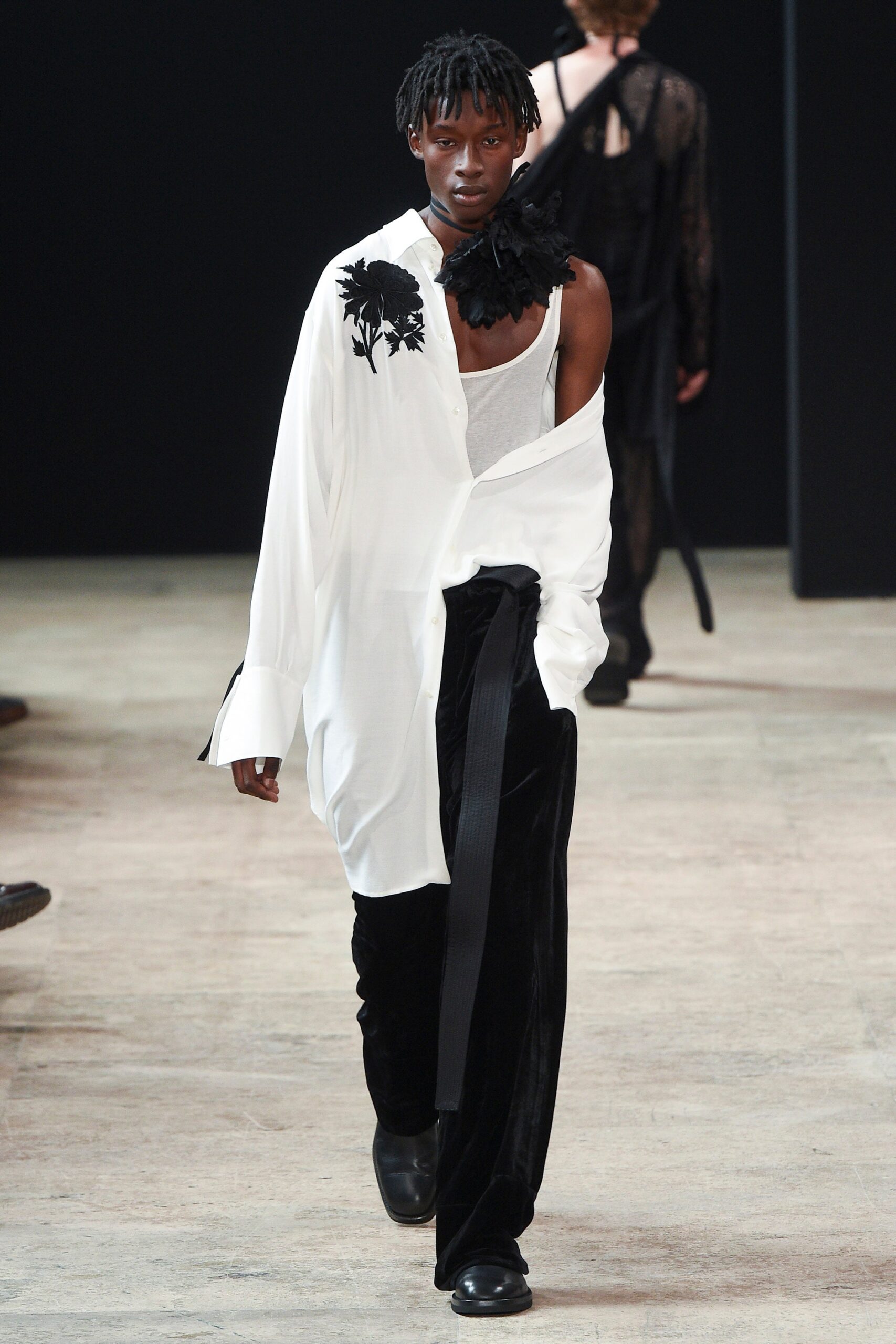 white relaxed shirt and black velvet pants