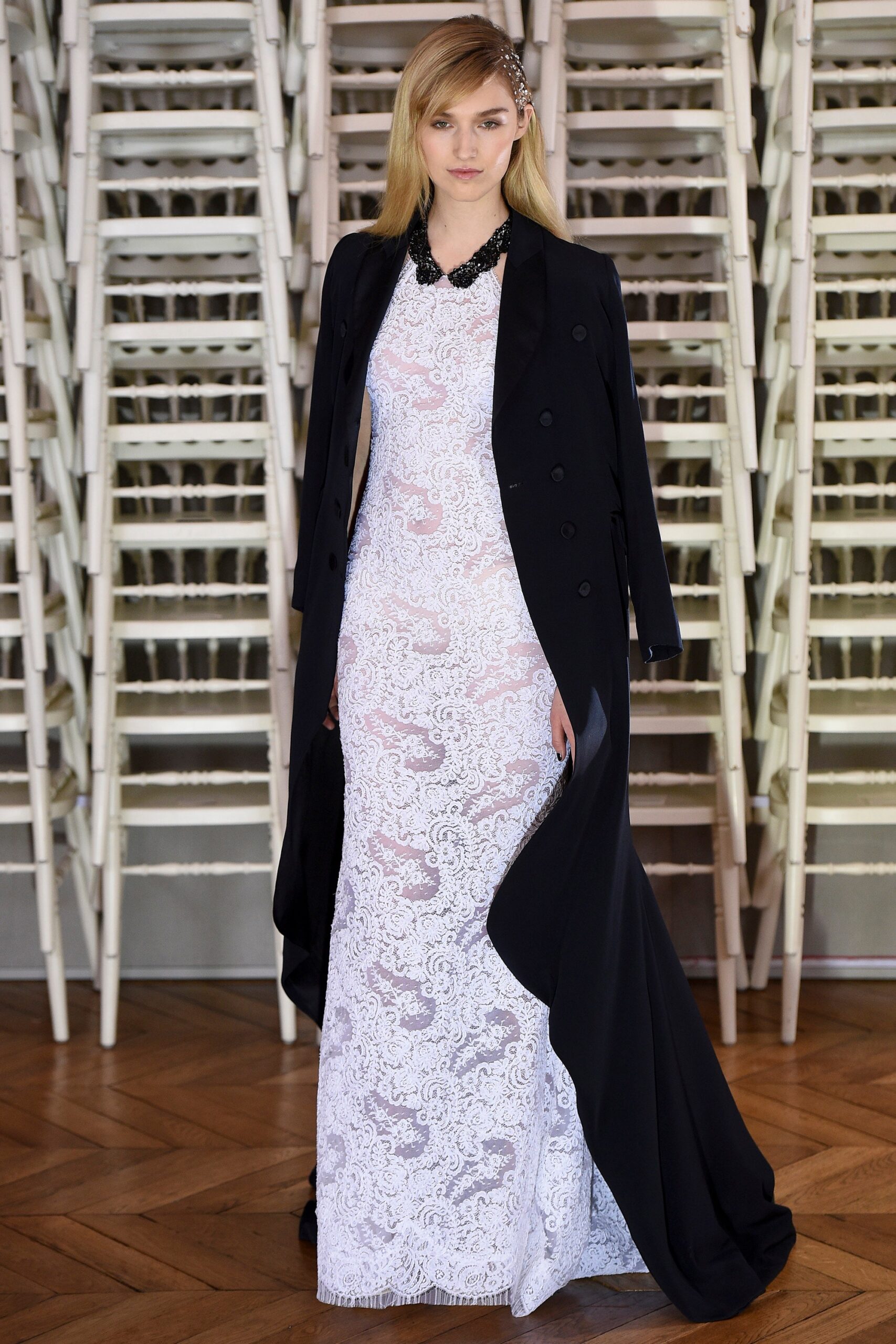 white lace fitted gown with black coat