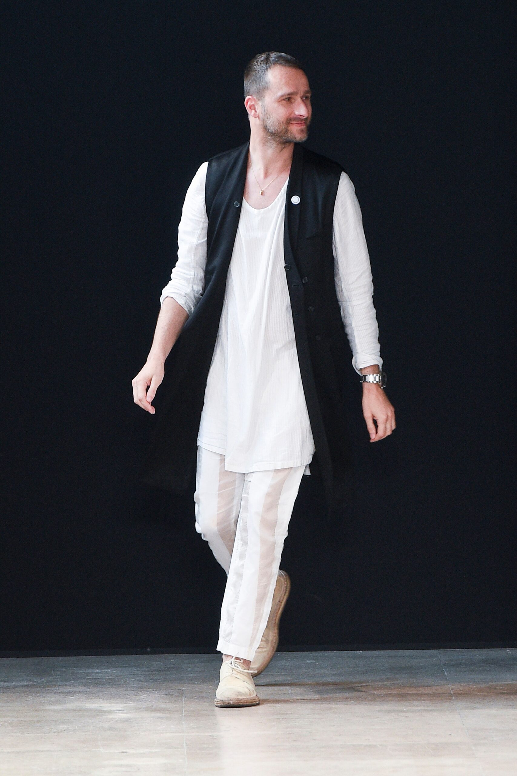 black vest white shirt and pants