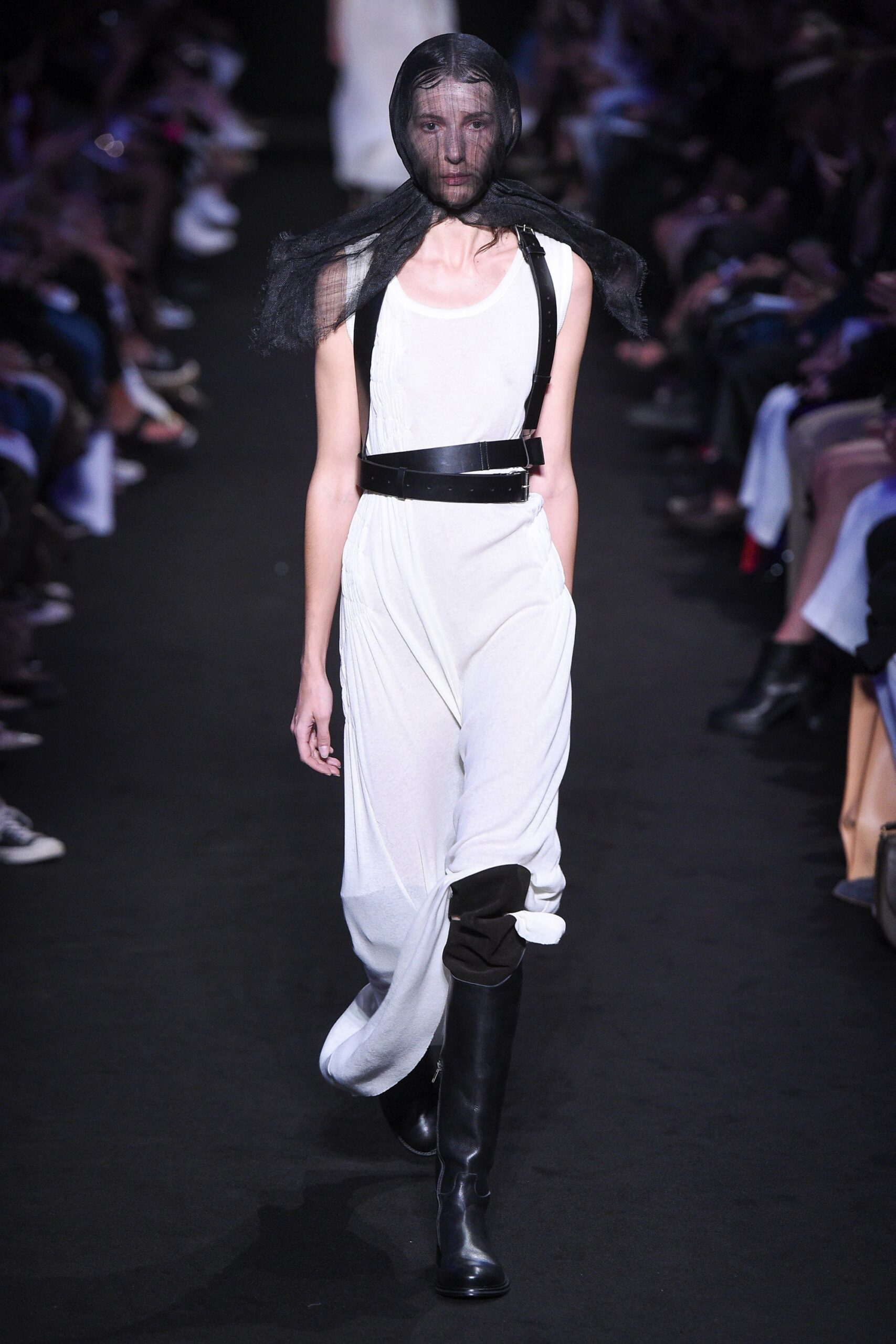 white fitted jumpsuit with black boots