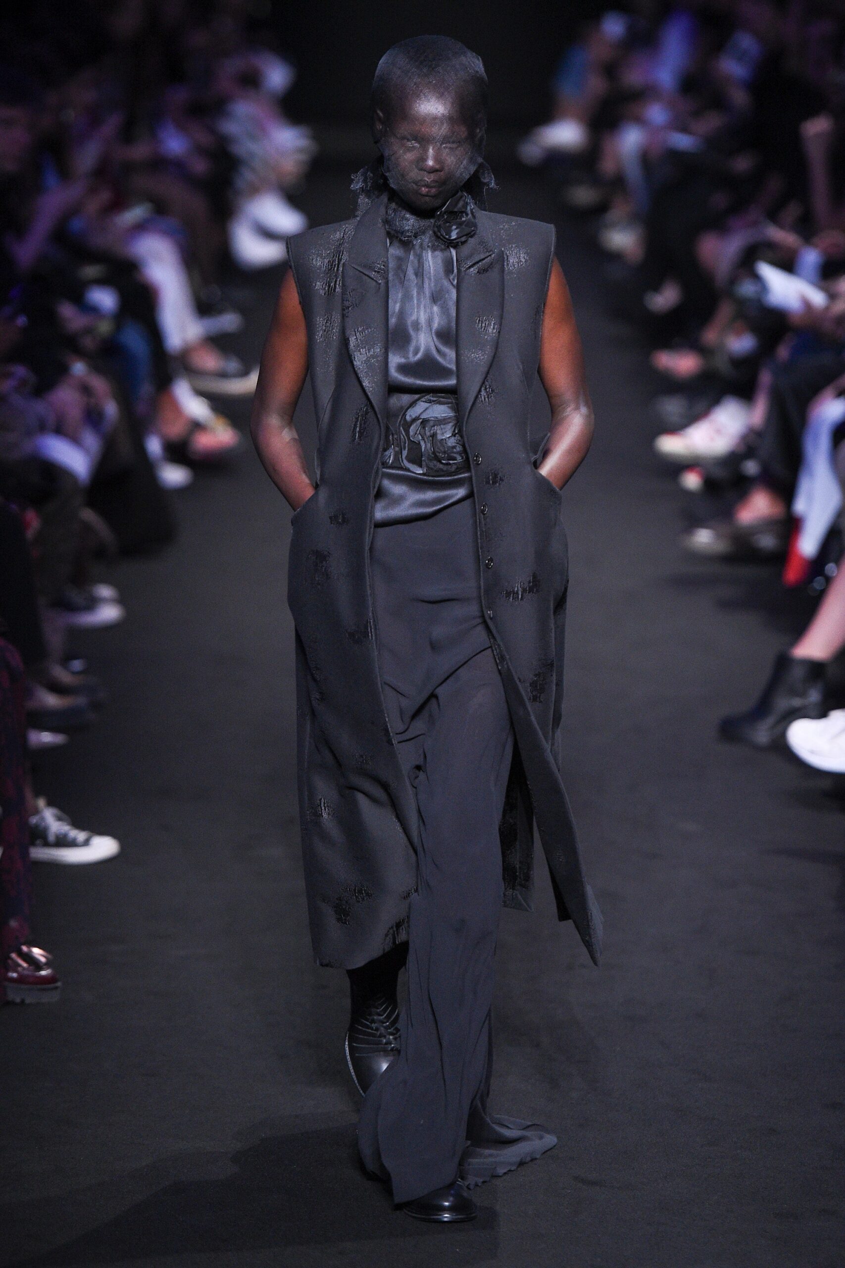 black silk sleeveless coat and fitted pants