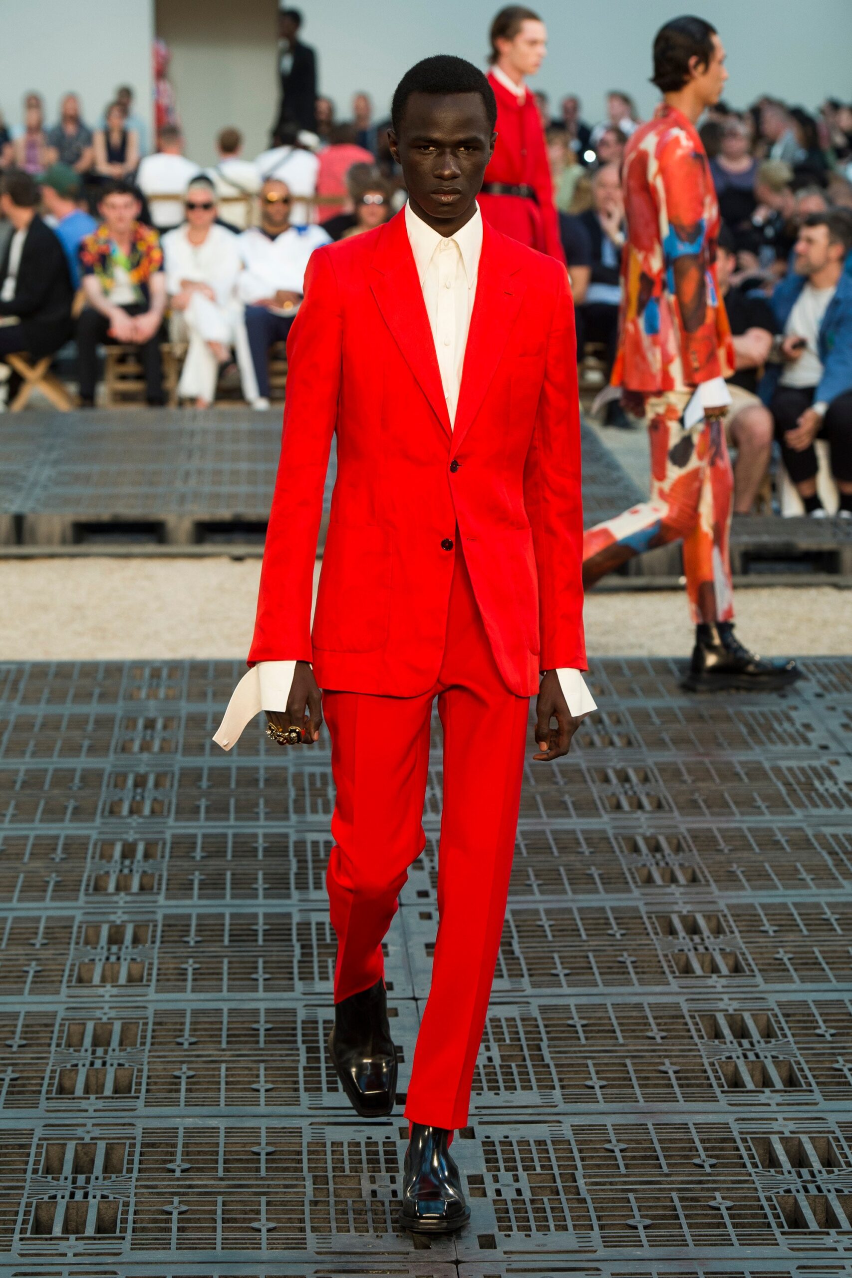 red tailored suit with white shirt