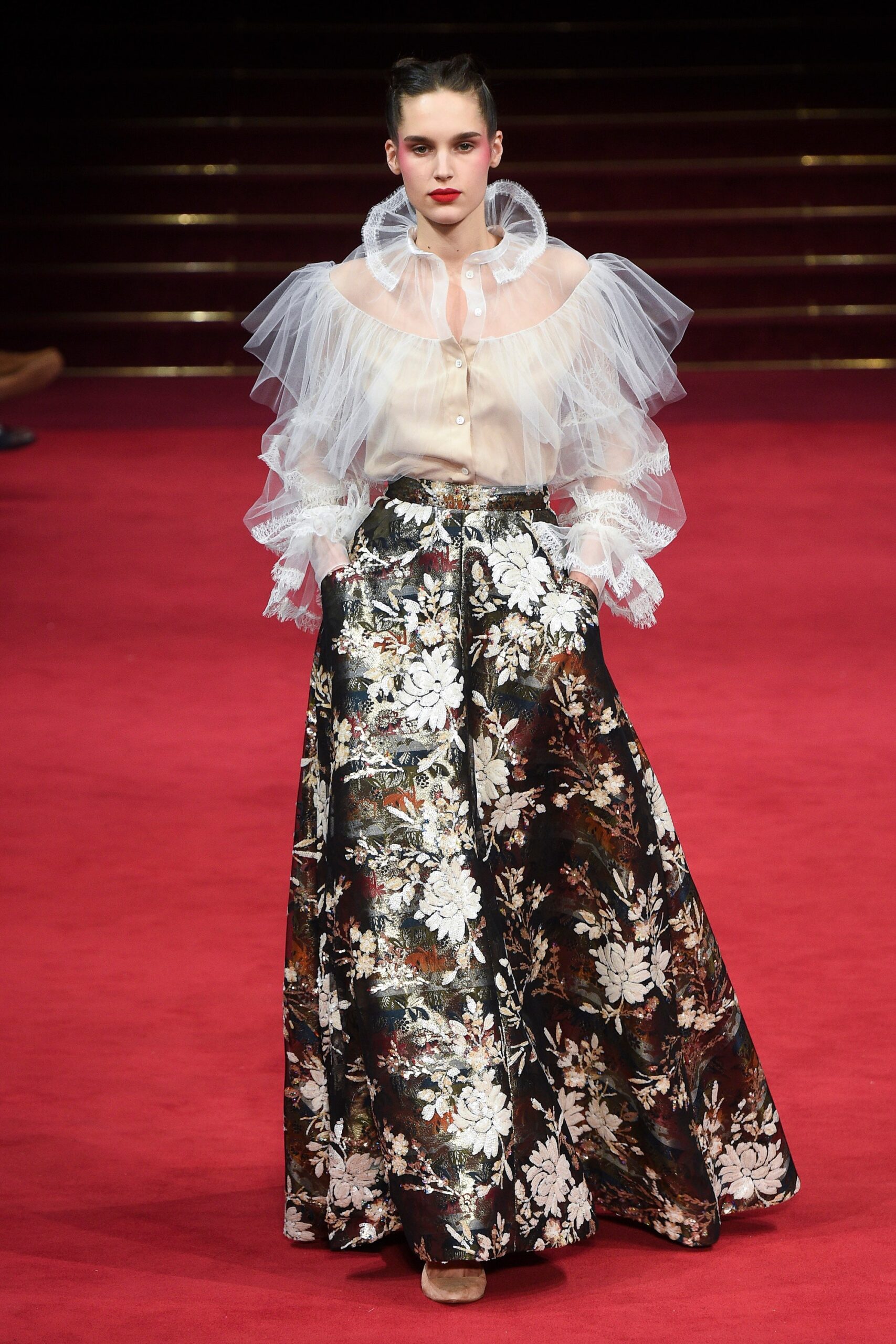 beige ruffled blouse and black flared skirt