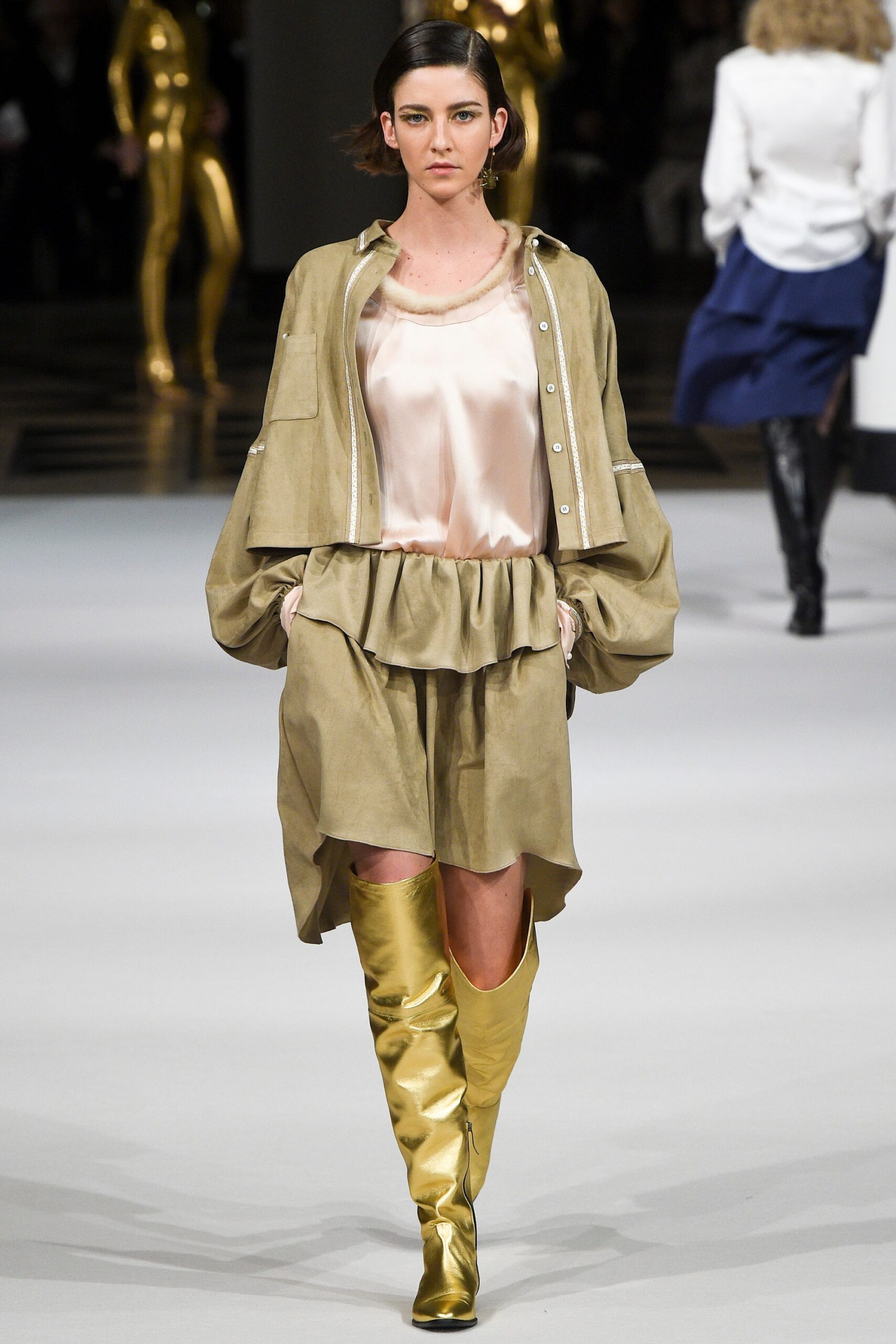 beige silk top and skirt with gold boots