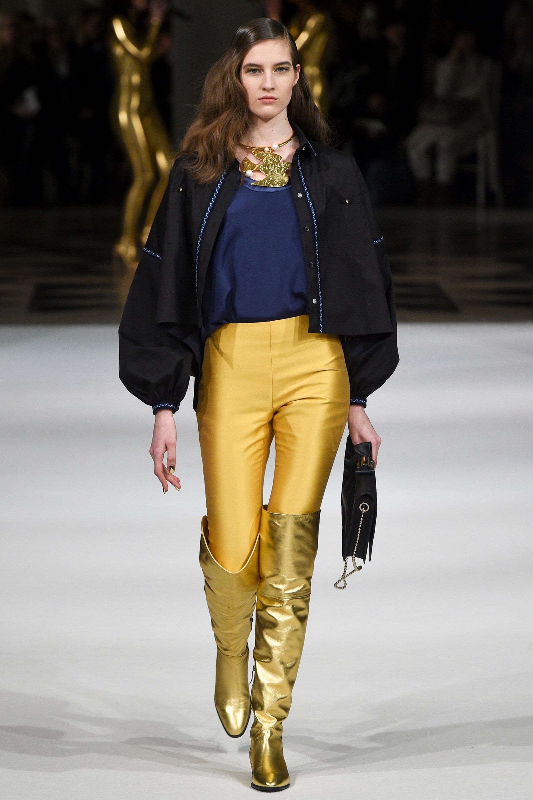 black jacket blue top yellow pants gold boots