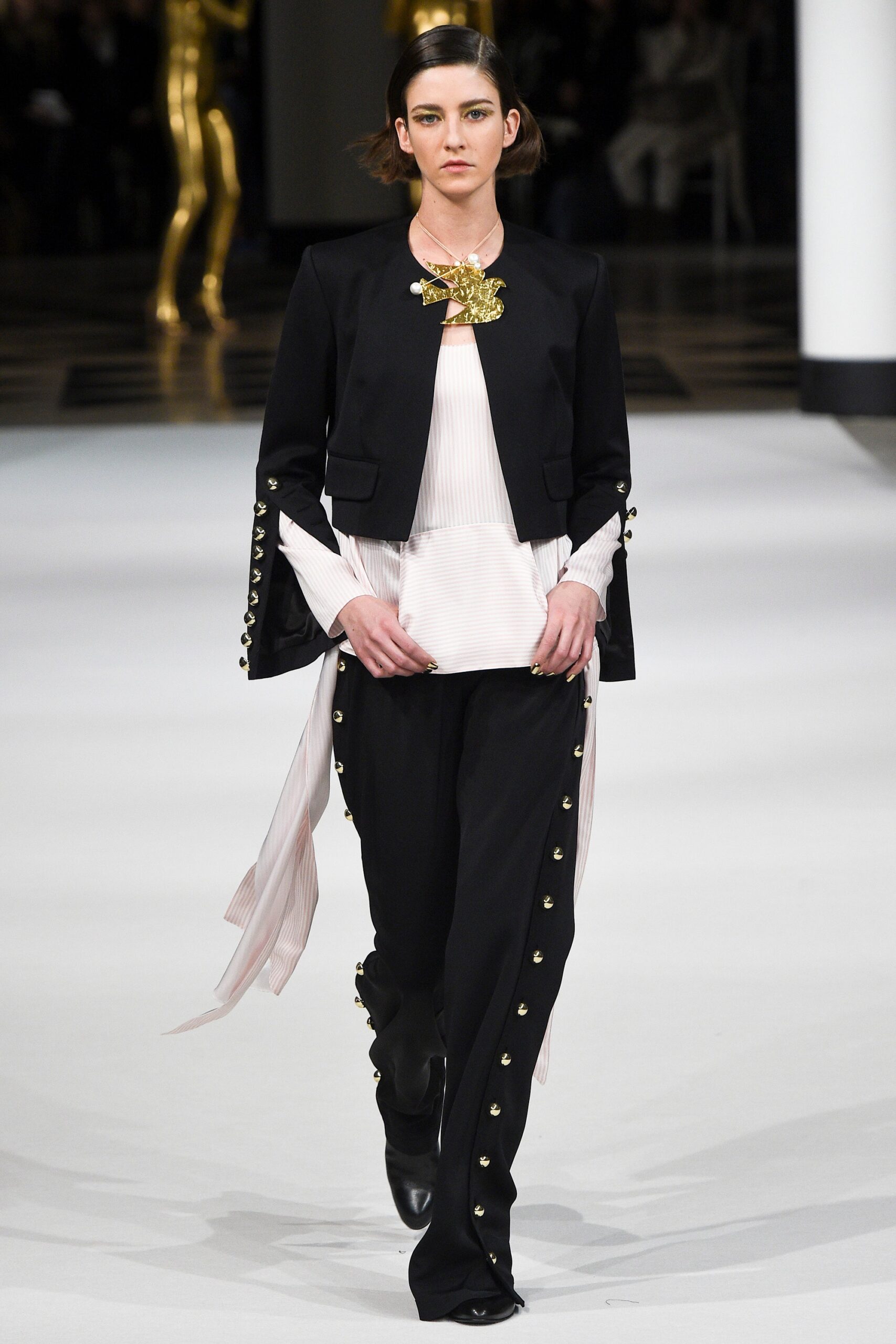 black tailored blazer white pleated top