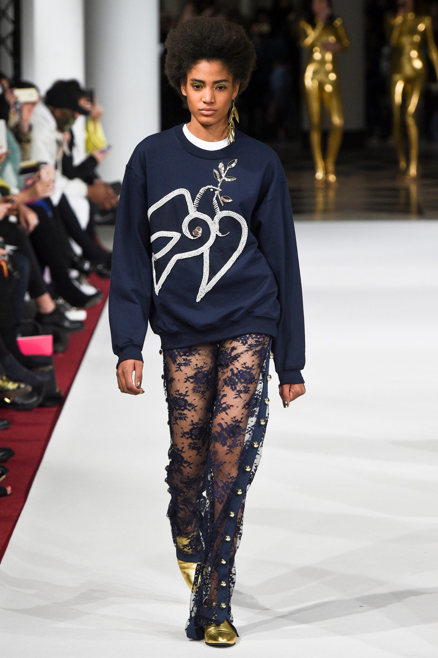 navy embroidered sweater with black lace pants