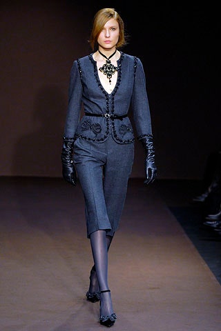 gray tailored suit with gloves