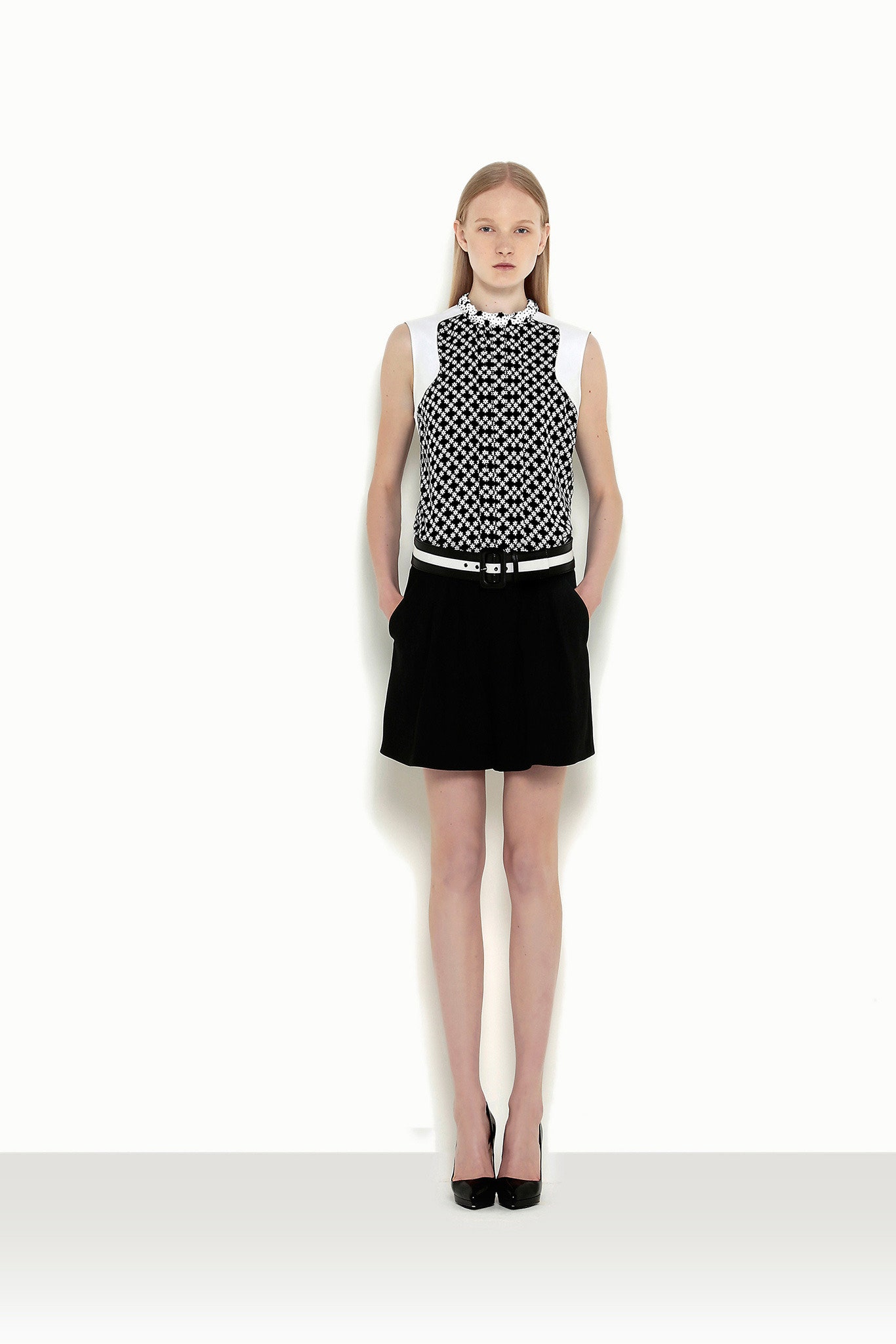 black and white fitted top with pleated skirt