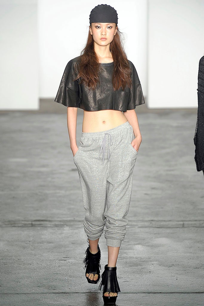 black leather cropped top with gray pants