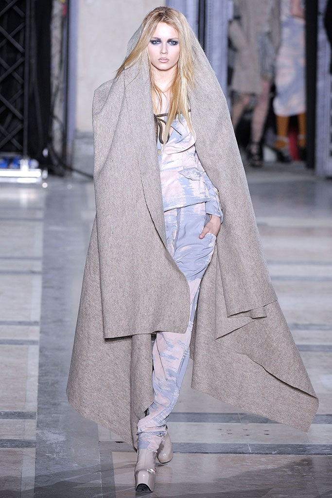beige wool coat with blue jumpsuit