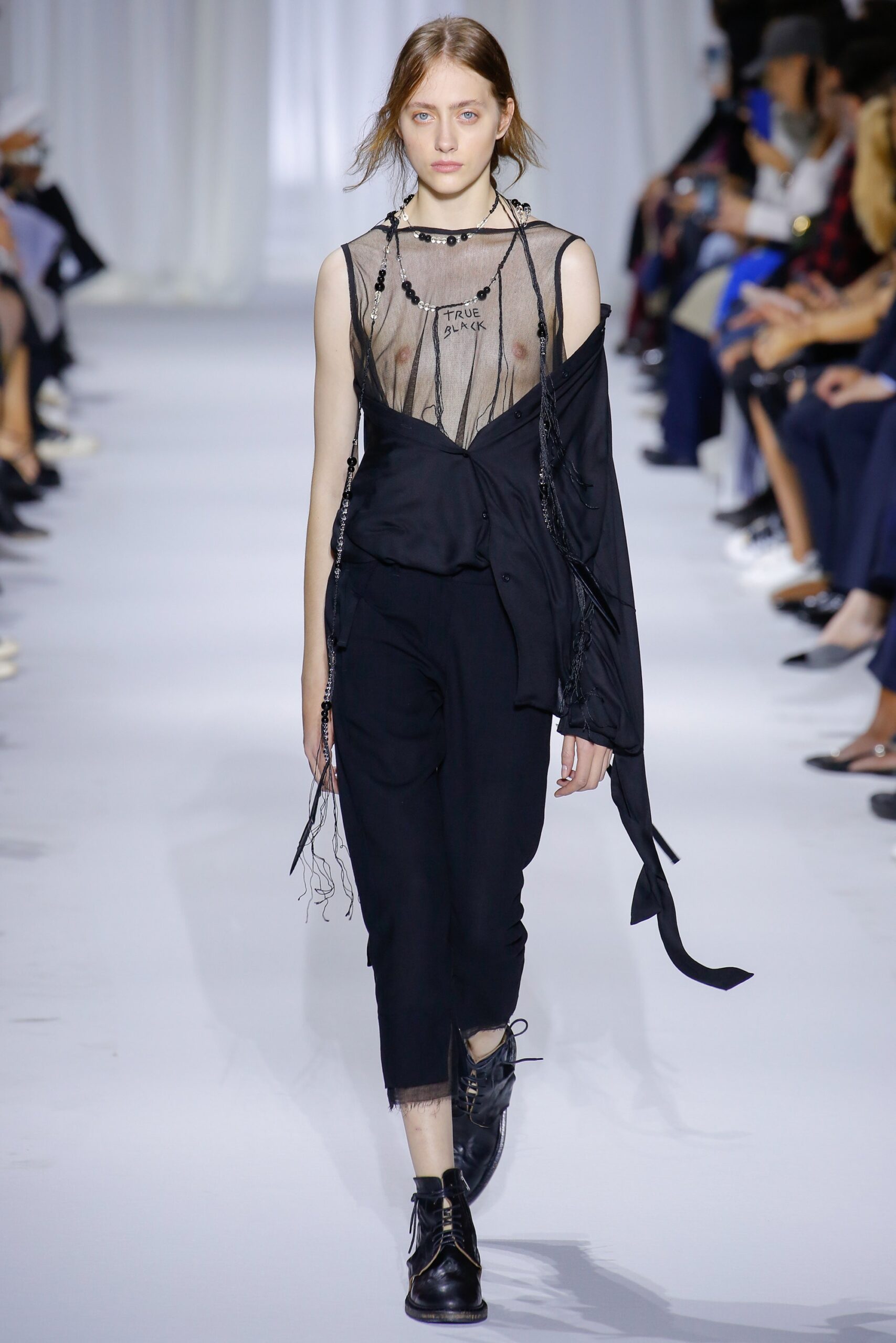 black sheer top with relaxed pants