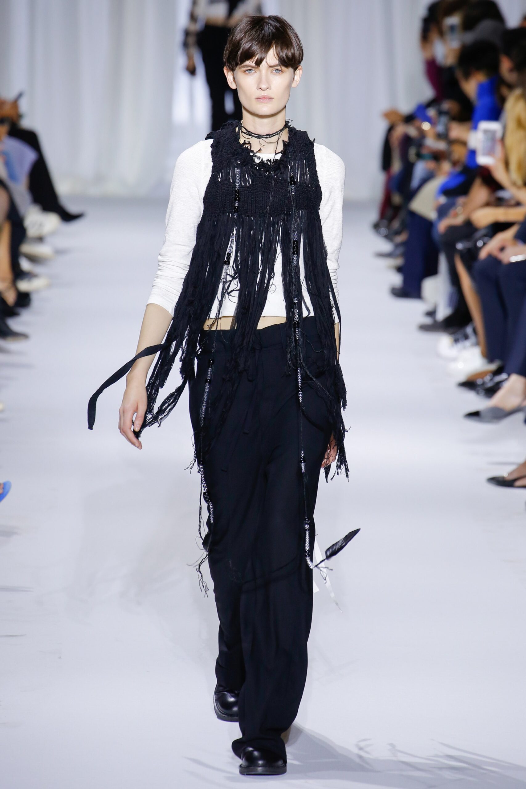 white fitted top with black vest