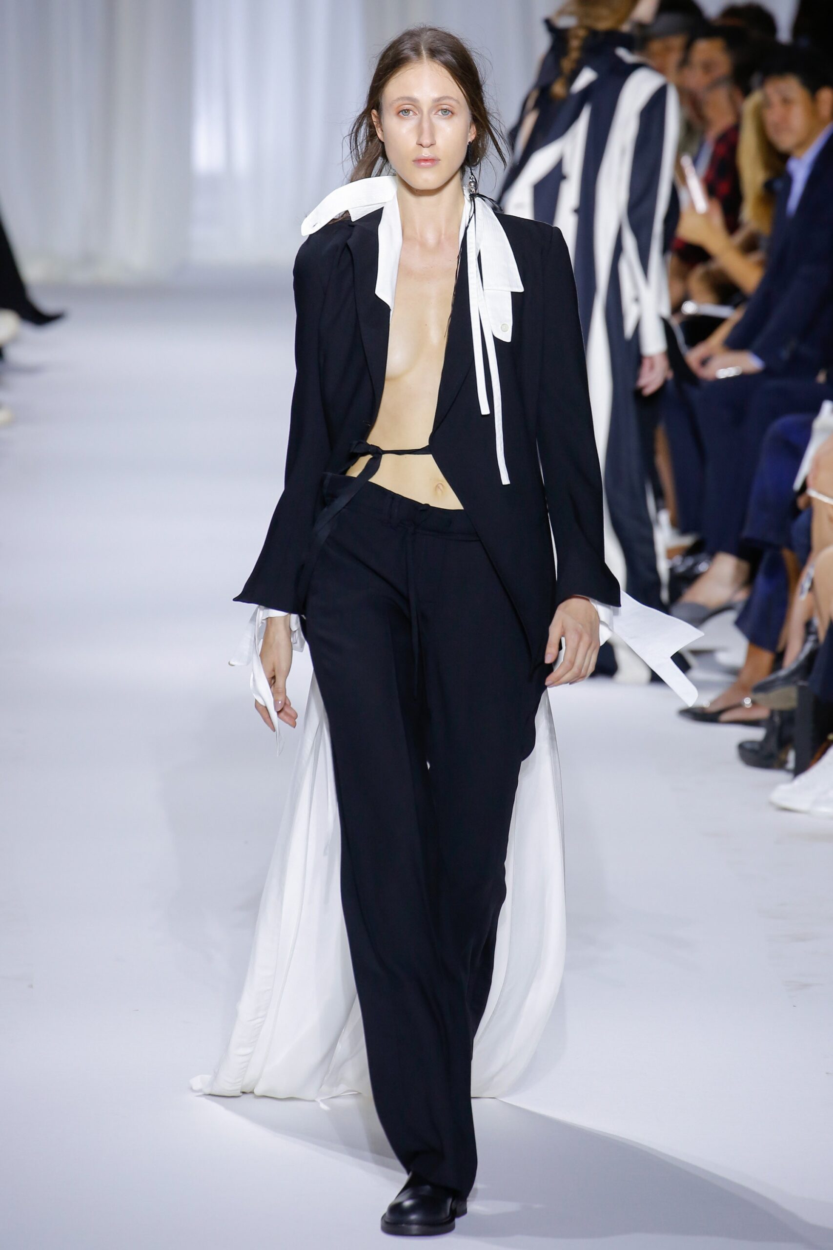 black fitted blazer with beige top